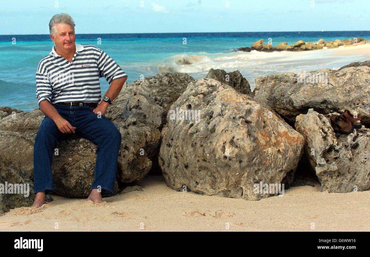 England coach Duncan Fletcher relaxes on the beach near the team hotel in Worthing, Barbados. England won the third Test on Saturday and took a 3-0 lead in the four match series against the West Indies. Stock Photo