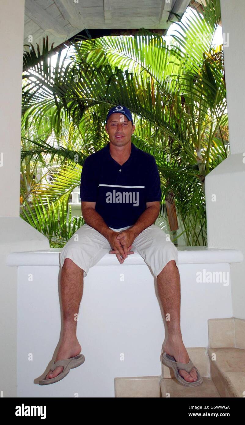 England batsman and former captain Nasser Hussain relaxes at the team hotel, Worthing, Barbados. England have won the Test series against the West Indies, leading 3-0 with the 4th and final match to be played in Antigua on Saturday. Stock Photo