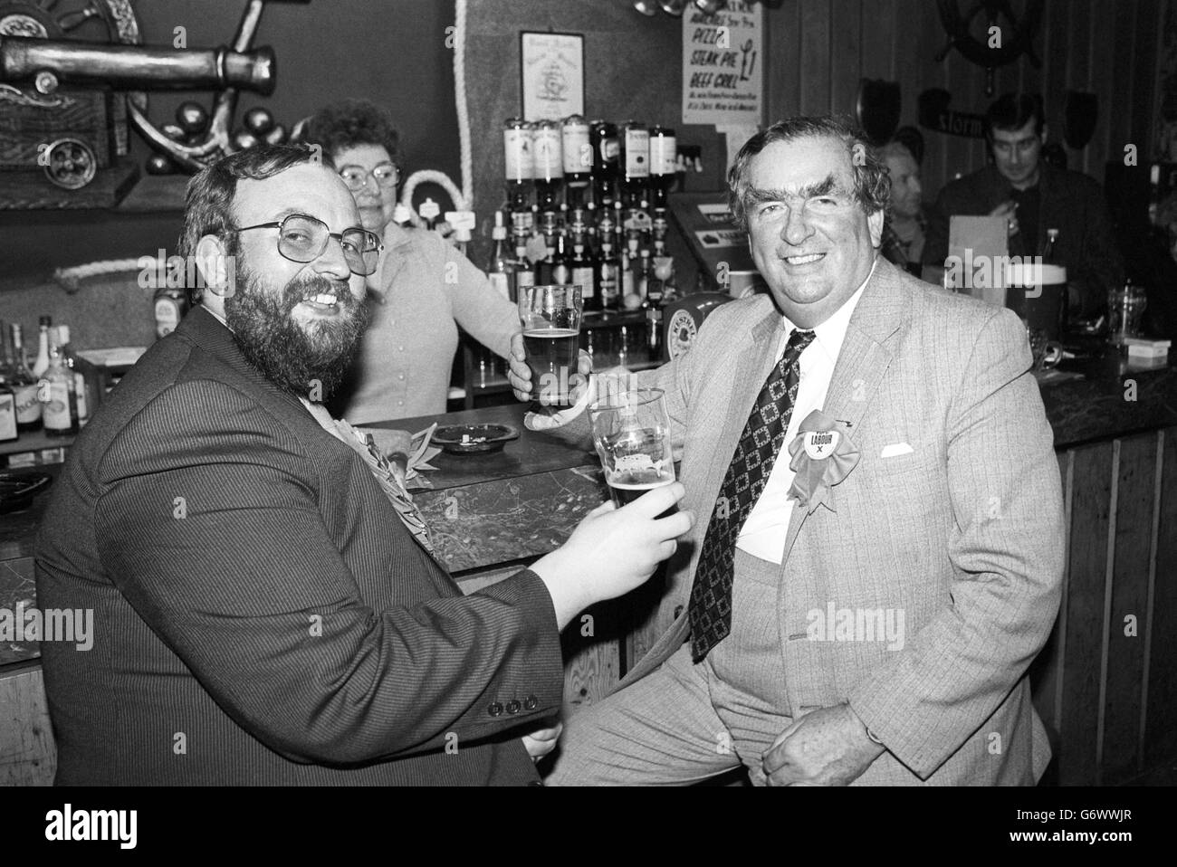 Labour's candidate in the Glasgow Hillhead by-election, David Wiseman (l), shares a toast with Labour party deputy leader Denis Healey in a Glasgow bar, the eve of polling day. Stock Photo