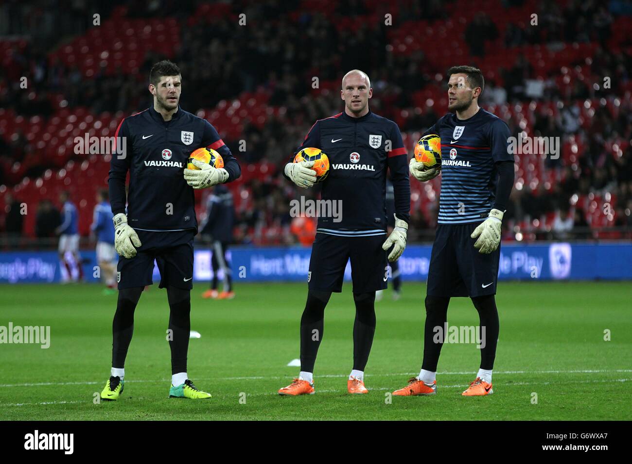 (left to right) England goalkeepers Fraser Forster, John Ruddy and Ben Foster during the warm up Stock Photo