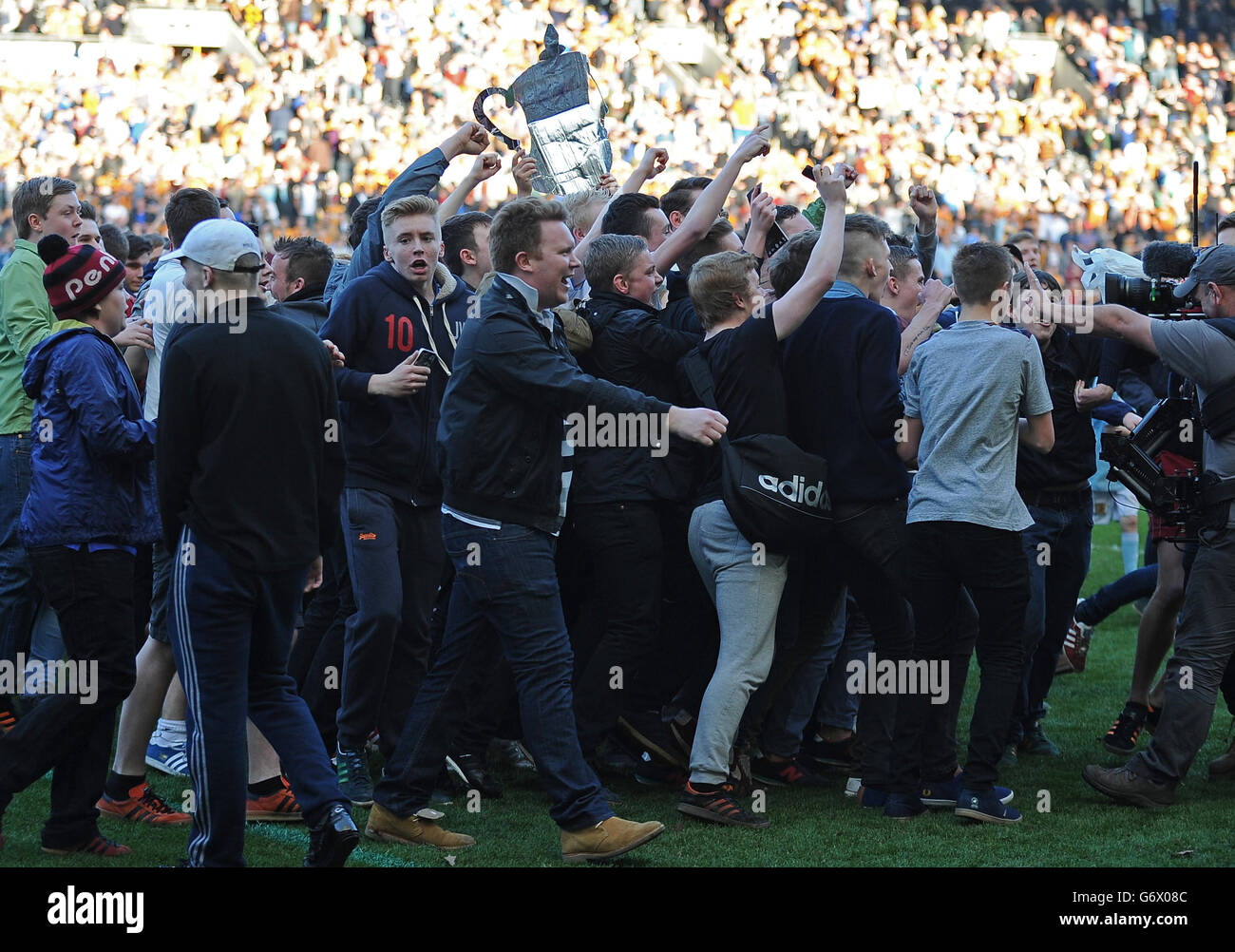Football full length pitch invasion invade crowd fans hires stock