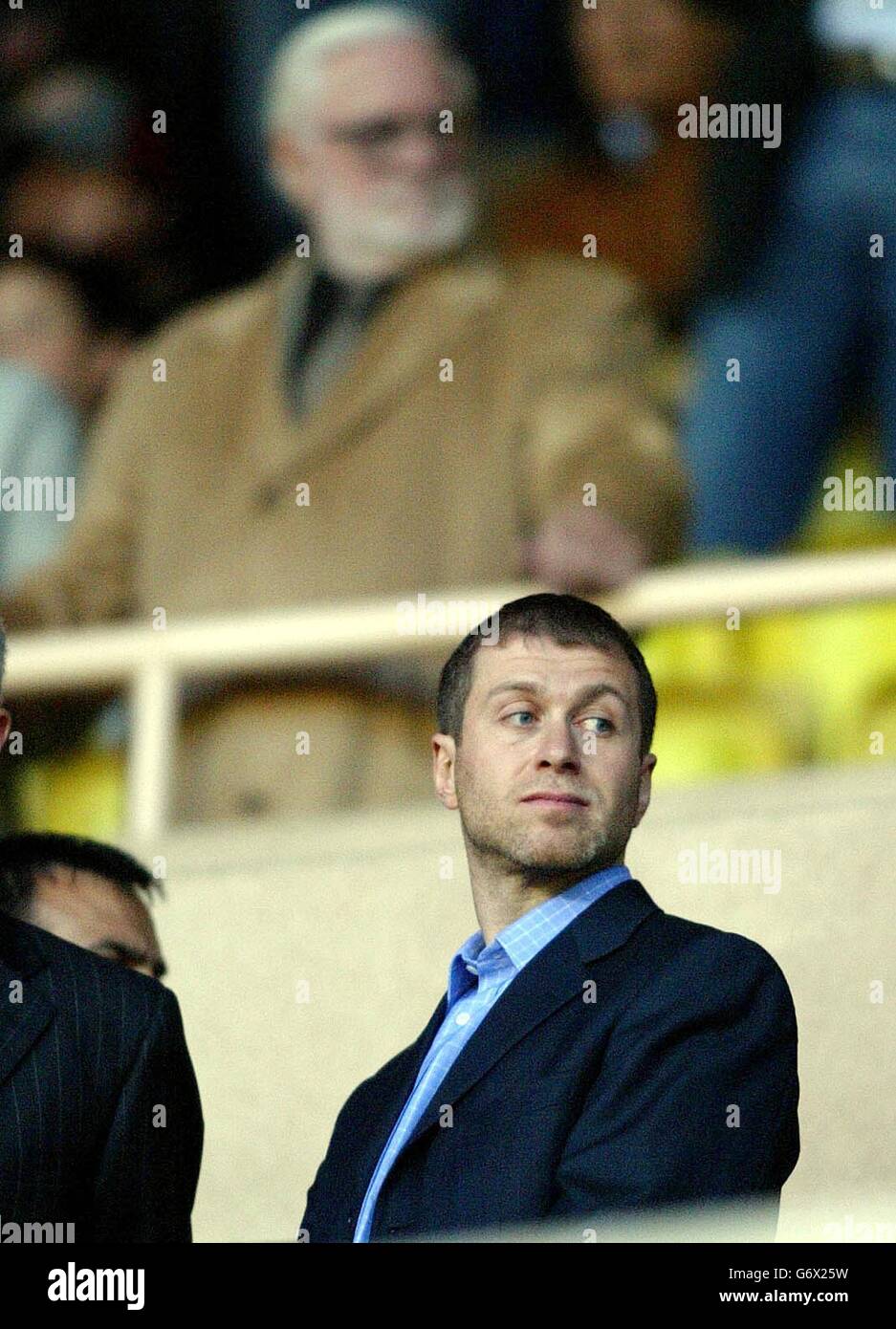 Chelsea owner Roman Abramovich and former Chairman Ken Bates (behind left) wait for the start of the UEFA Champions League semi final 1st leg match at the Stade Louis II in Monaco Stock Photo