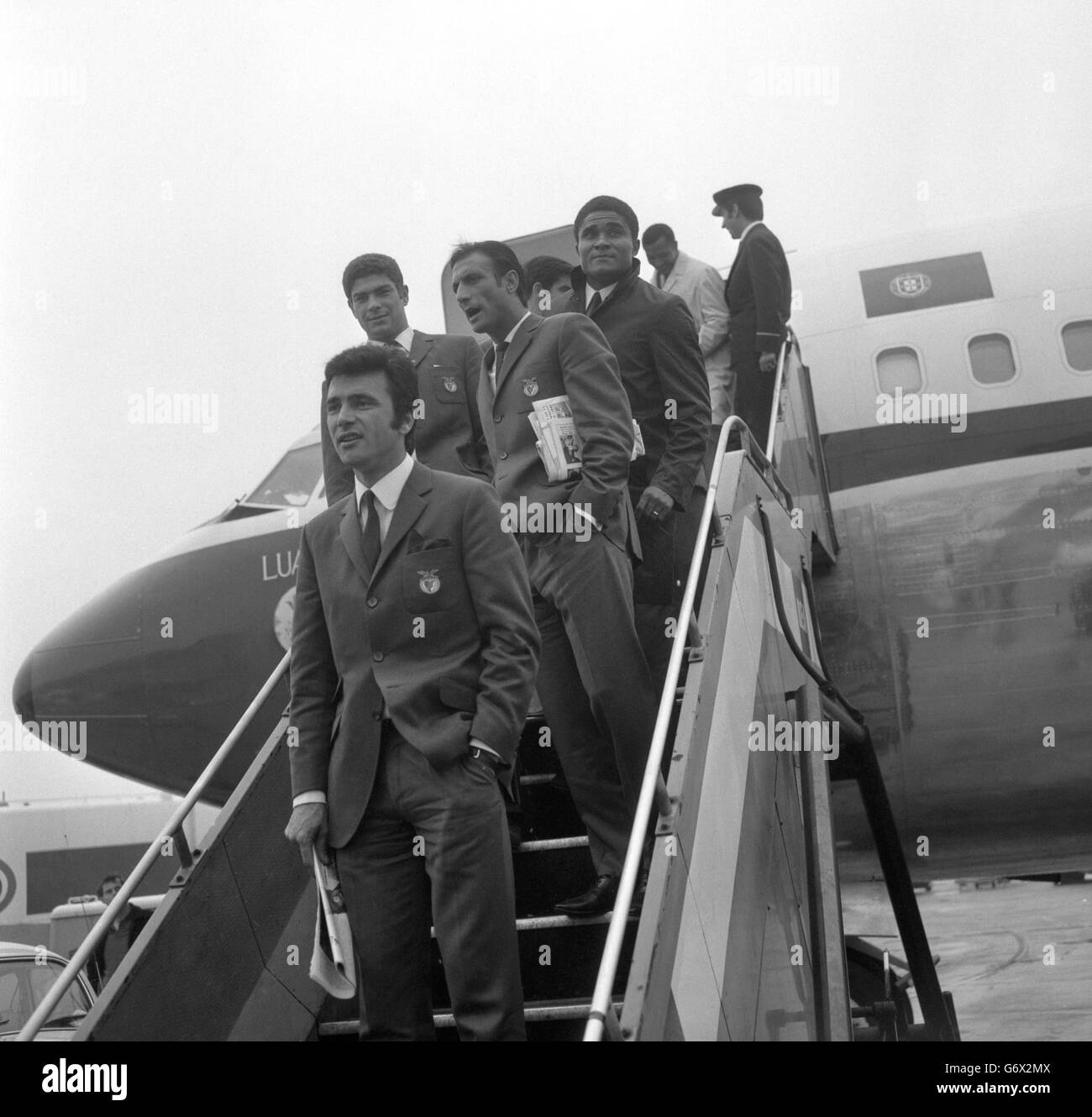 The Benfica players leaving their plane after arriving at Heathrow Airport ahead of their European Cup Final match against Manchester United at Wembley Stadium. (top right) Eusebio. Stock Photo