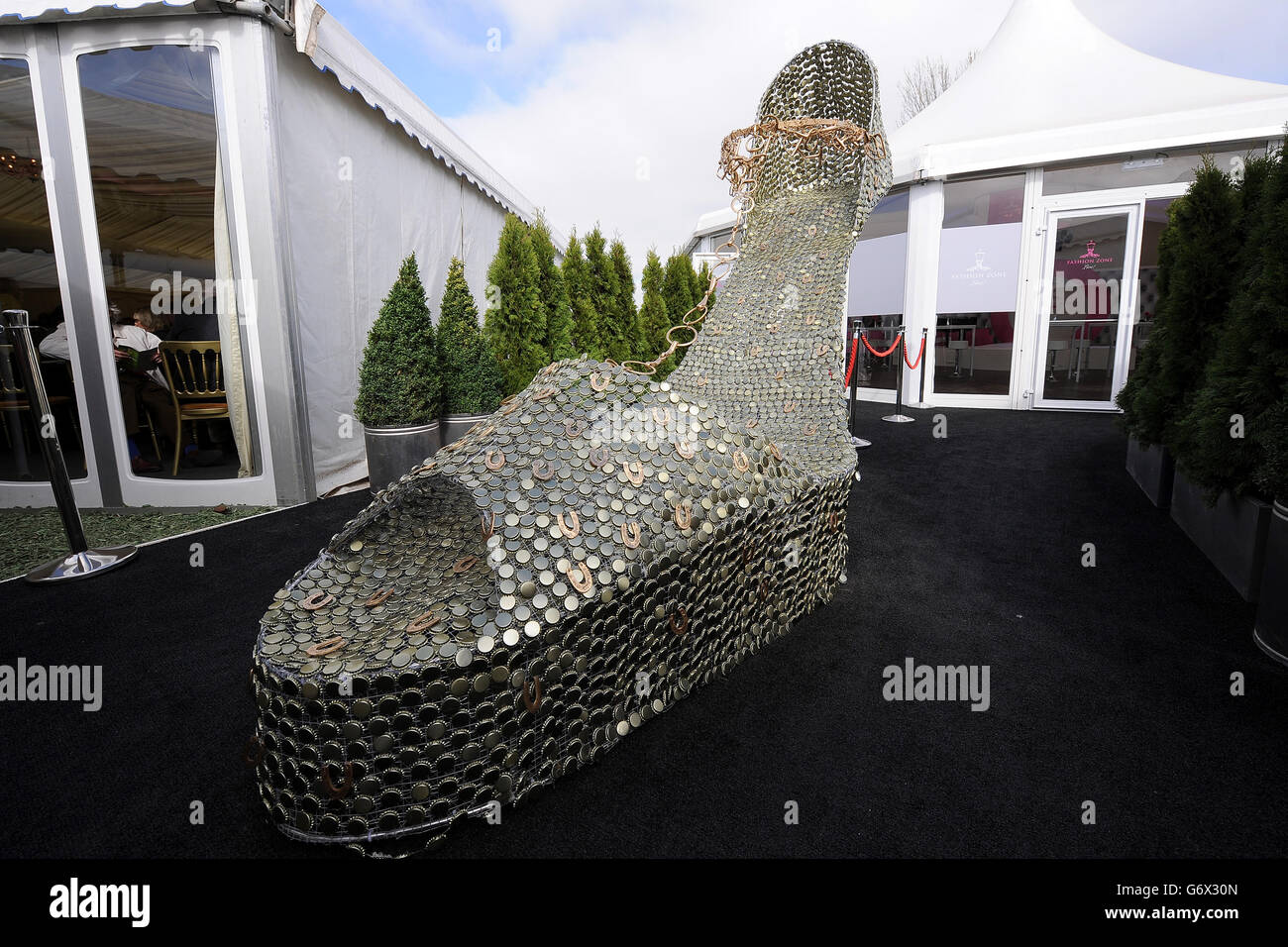 A giant statue of a ladies shoe outside the Fashion Zone Stock Photo
