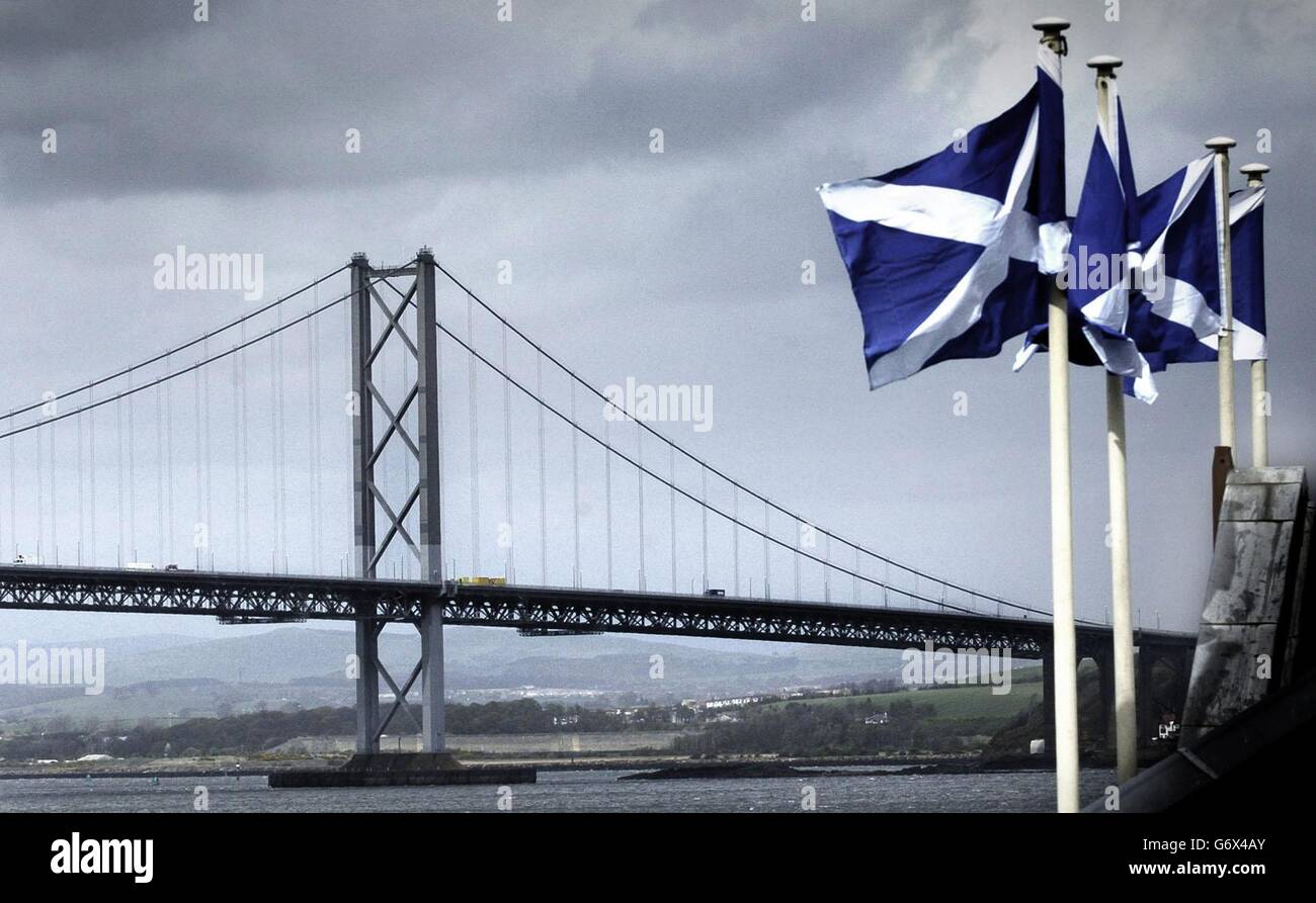Scottish flags fly in front of the Forth Road Bridge Stock Photo