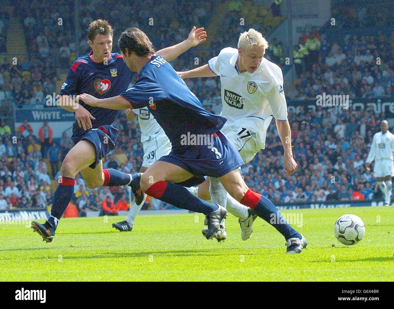 Alan Smith (right) of Leeds United watches the ball run away from him during the Barclaycard Premiership match at Elland Road. Stock Photo
