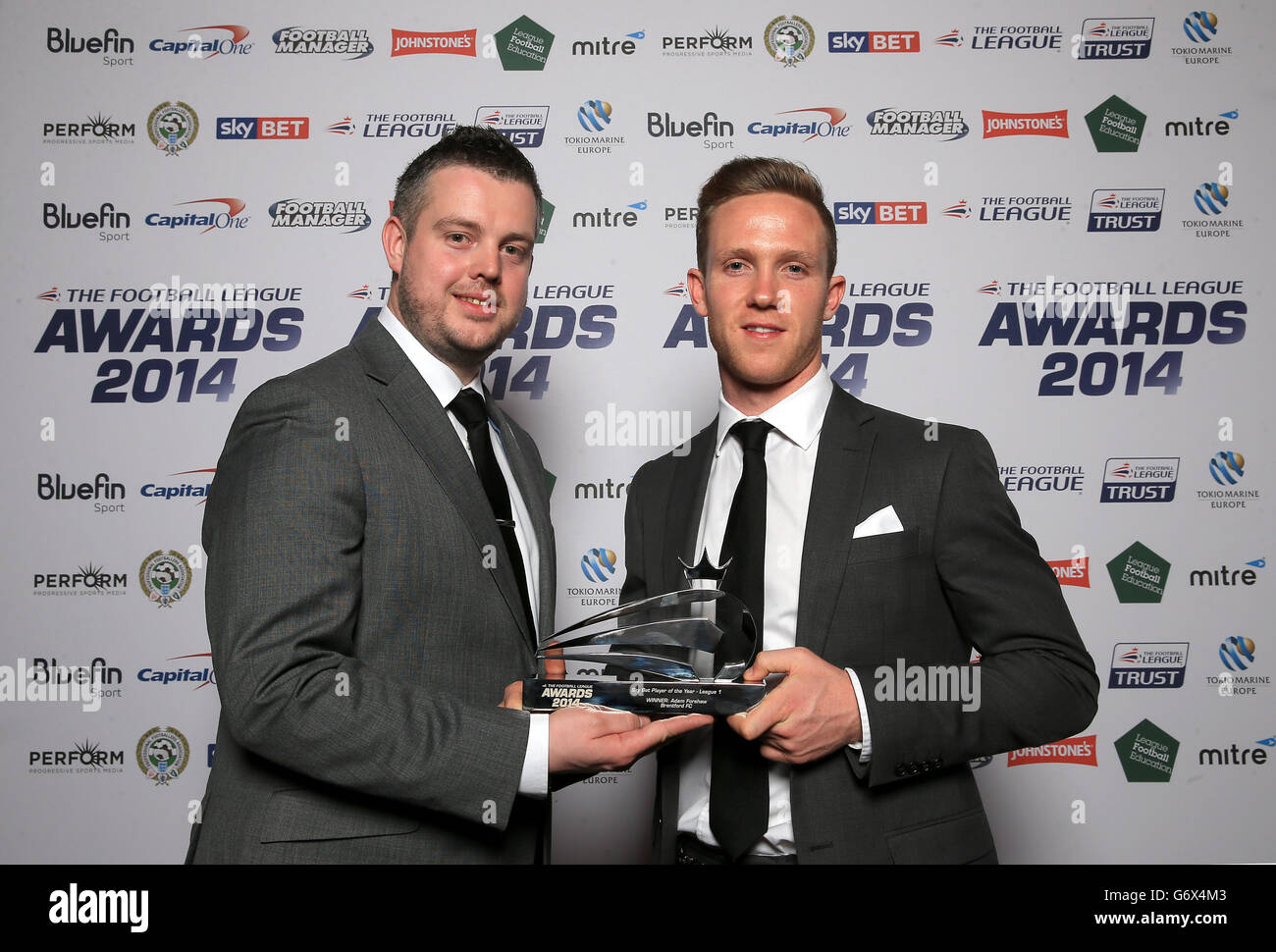 Brentford's Adam Forshaw (right) with his Sky Bet Player of the Year for League 1 award and sponsor Stock Photo
