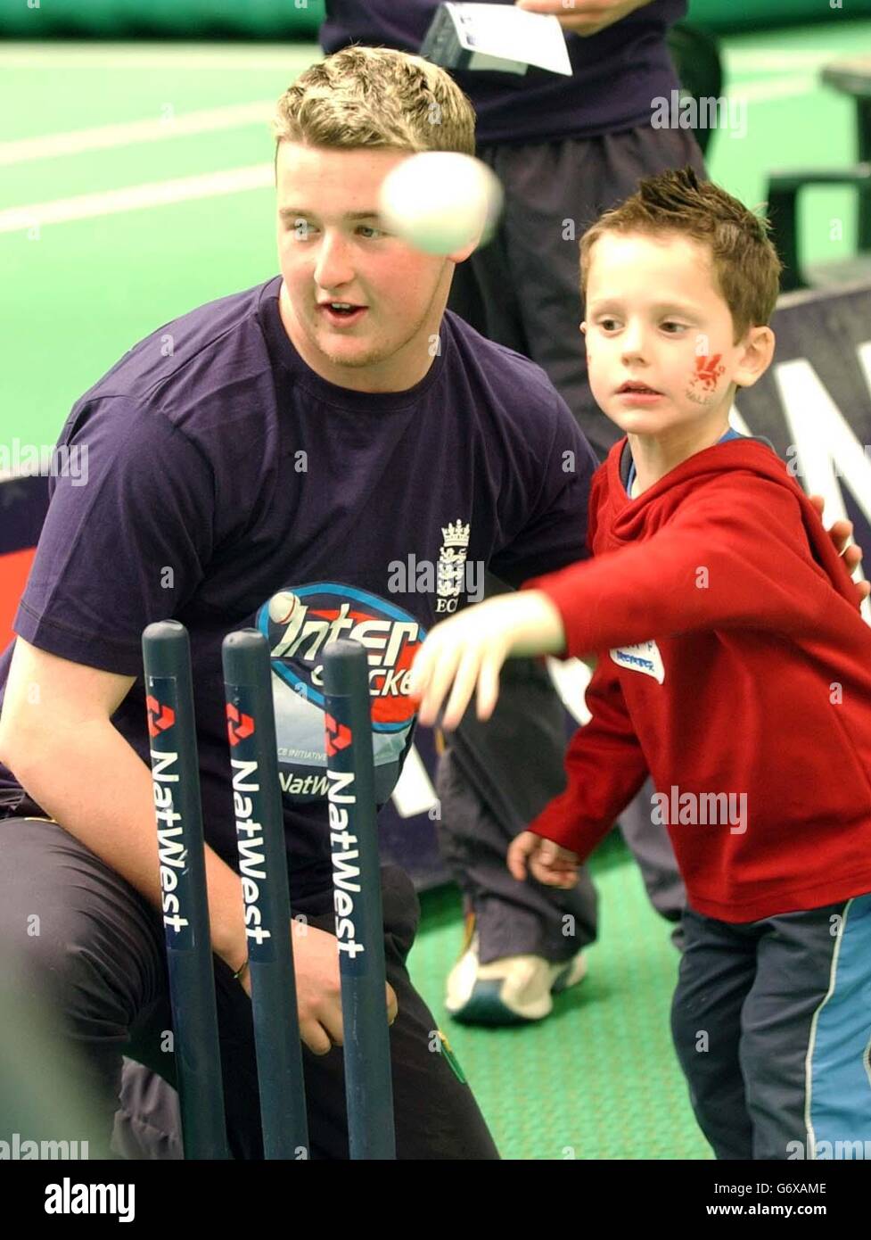 NatWest Speed Stars 2004. Glamorgan cricketer Richard Grant helps Sam Proctor from Cardiff with his bowling technique. Now in its third year, the NatWest Speed Stars competition is a nationwide competition to find the UK s fastest young bowlers. Open to all boys and girls under 18 years old, it offers juniors the chance to test their bowling speed with the possibility of qualifying for the NatWest Speed Stars final at Lord's on 5 September. Stock Photo