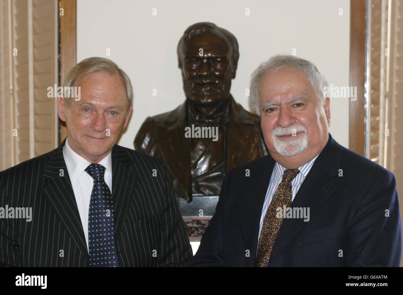 Presiding Officer George Reid with Vartan Gregorian, the President of the Carnegie Corporation of New York, and a bust of Andrew Carnegie. Stock Photo