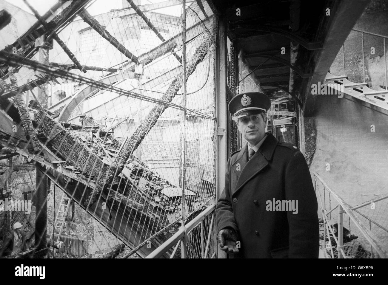 Chief Officer One, Douglas Branch, surveys the fire-damaged HM Chelmsford Prison from a gallery of the central control complex. Four out of five cell blocks and the prison chapel were also damaged in the blaze Stock Photo