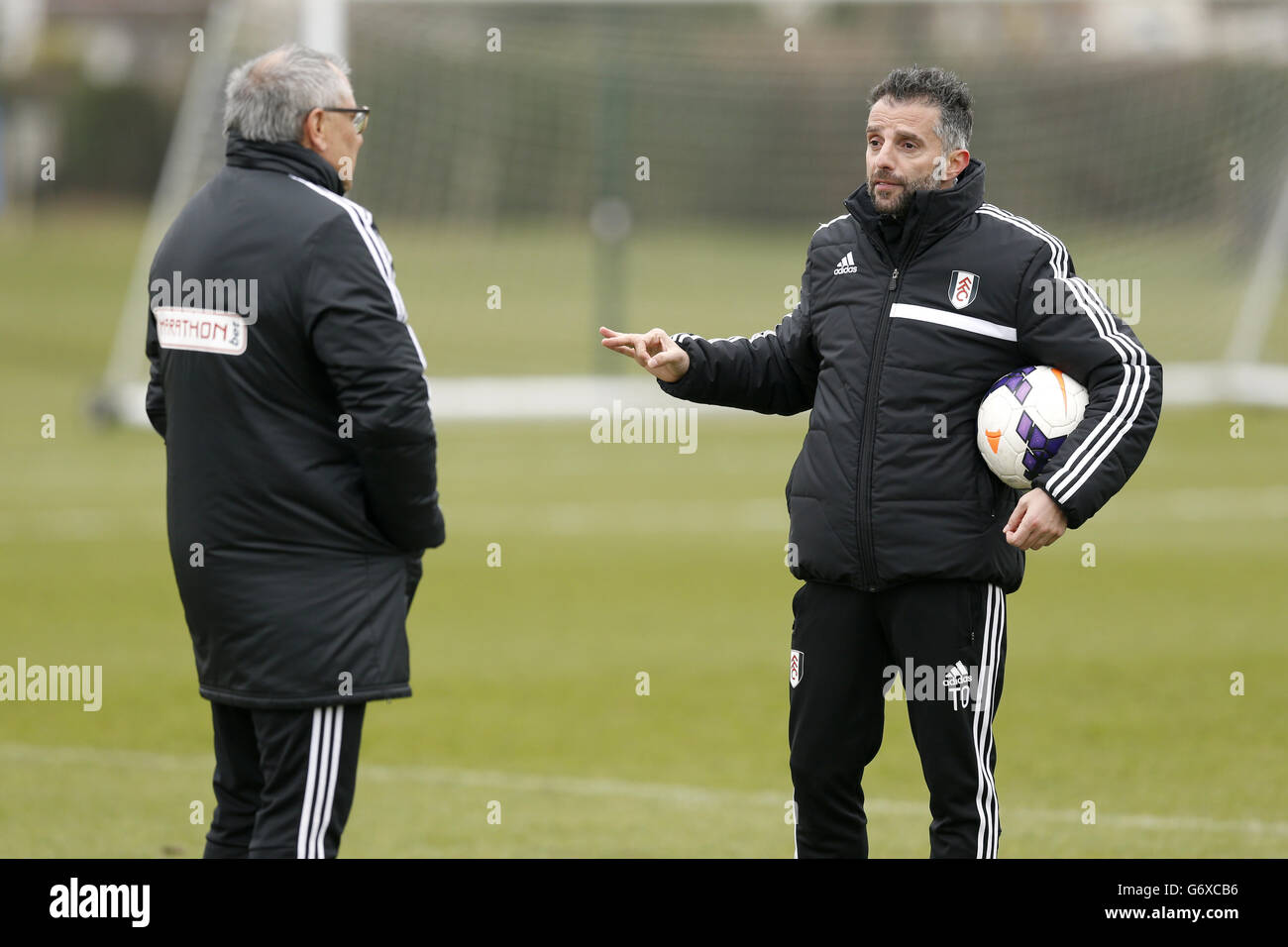 Soccer - Fulham Open Training Session - Motspur Park. Fulham manager Felix Magath speaking with first team coach Tomas Oral (right) during training Stock Photo