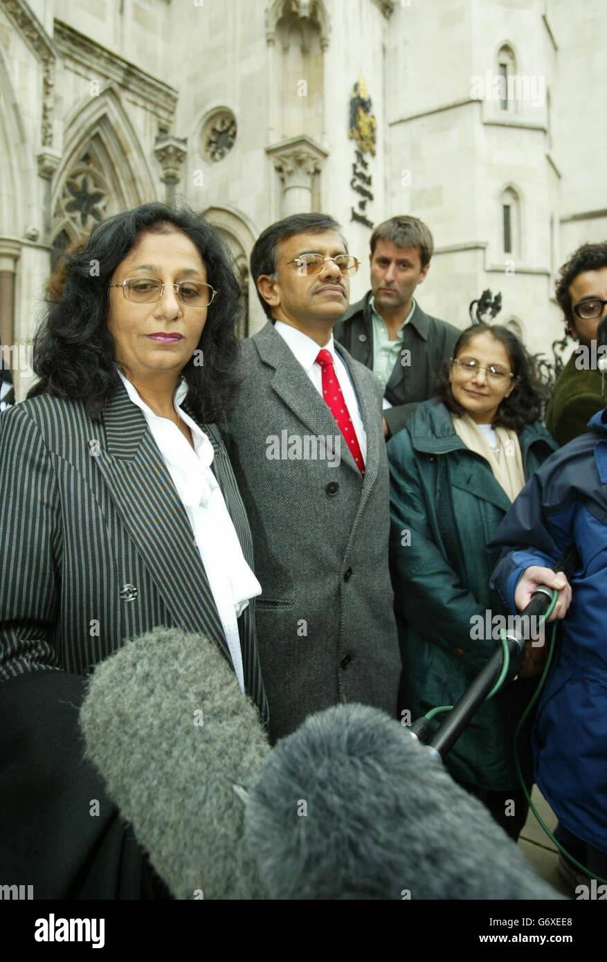 (L-R) Chitralekha Mehta, Yogesh Pathak, Anila Shastri, stand outside the High Court, London, speak to the media following the bitter legal battle which tore apart the family behind the multi-million pound 'Patak's' spices empire, has today ended in a provisional 12 million settlement. The family have agreed a peace pact at the Court between company boss Kirit Pathak and his two married sisters, who claimed they had been cheated out of shares allocated to them by their late father. Sisters, Chitralekha, 56, and Anila, 52, said later that they will receive a total of around 6 million each under Stock Photo