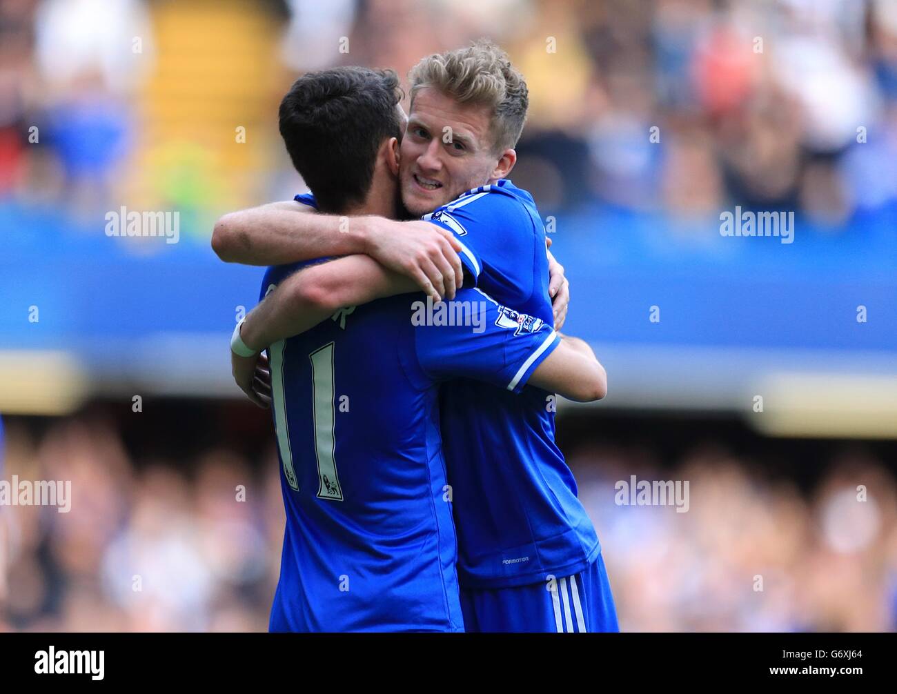 Chelsea's Emboaba Oscar celebrates scoring his side's fifth goal with Andre Schurrle (right) Stock Photo