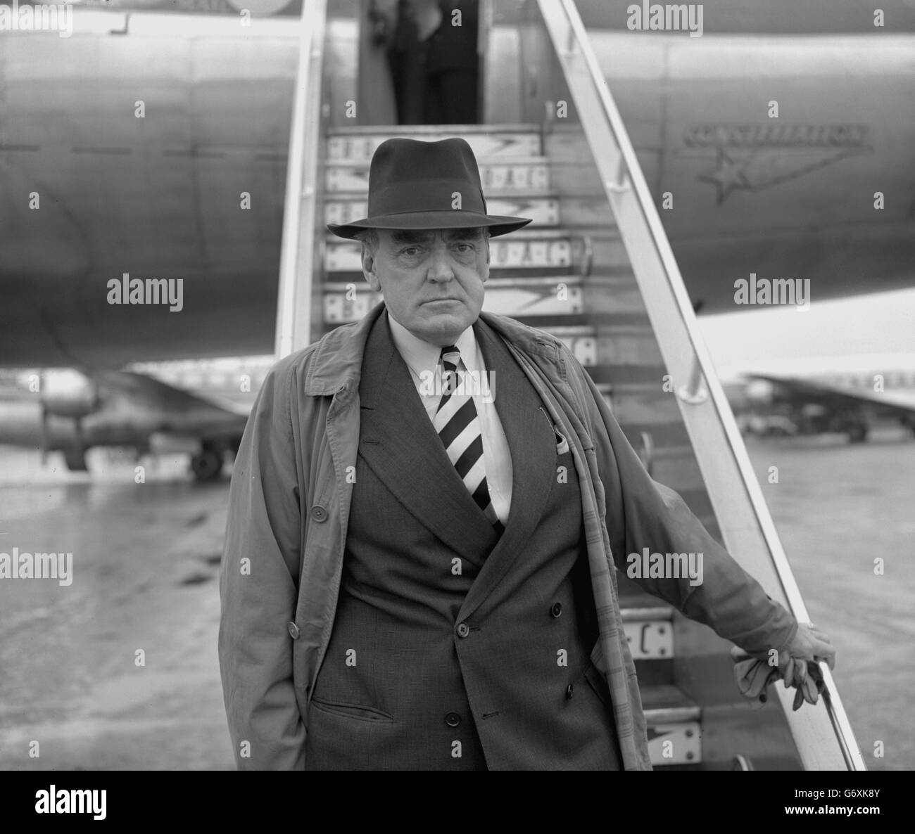 Lord Reith, chairman of the Colonial Development Corporation, at London Airport as he boards a BOAC liner for Salisbury, Southern Rhodesia. Stock Photo