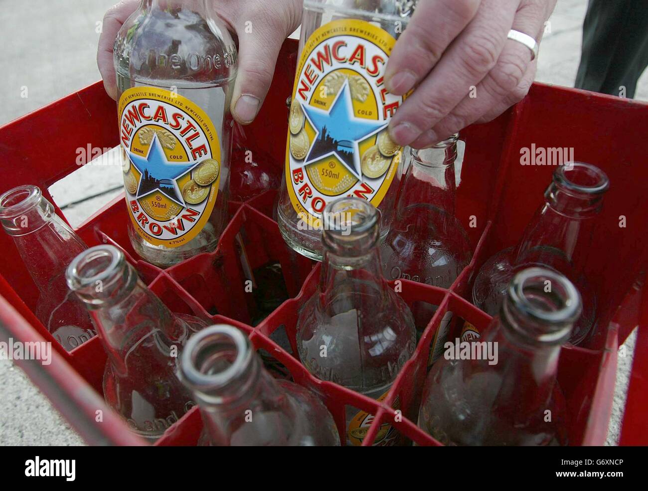 Empty bottles are placed in a crate at the factory of brewer Scottish Courage, which plans to move production of its Newcastle ale brands to the Northern Clubs Federation Brewery (NCFB) across the Tyne in Dunston, it will acquire for 7.2 million. The move to the NCFB site will involve the loss of around 100 jobs. Todays announcement means that the world famous Newcastle Brown Ale will no longer be brewed in the city, since the production in 1927, known also for its advertising slogan 'The One and Only'. Stock Photo