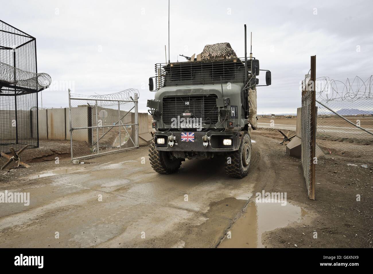 The very last British Combat Logistics Patrol (CLP) arriving at the gates of Camp Bastion making the last road move to recover equipment and material from closed down UK operating bases in Helmand Province, Afghanistan. 15/03/14. Stock Photo