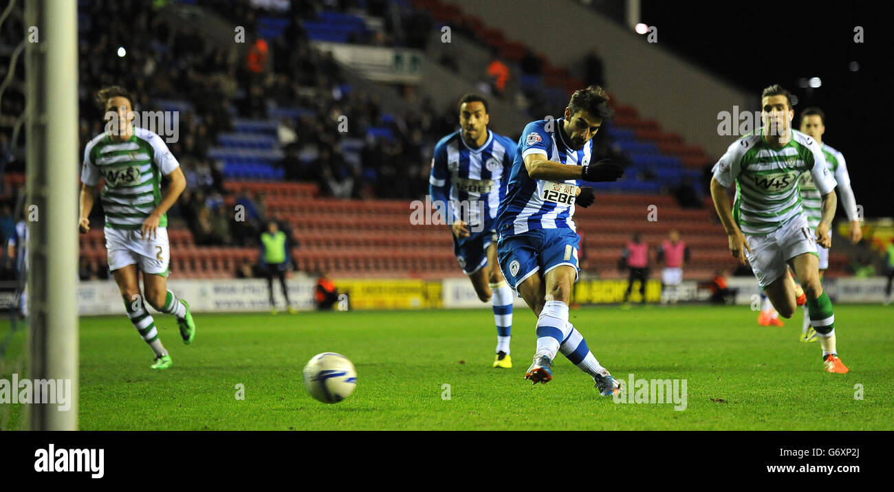 Wigan Athletic's Jordi Gomez's penalty is saved by Yeovil Town's goalkeeper Marek Stech (out of picture). Stock Photo