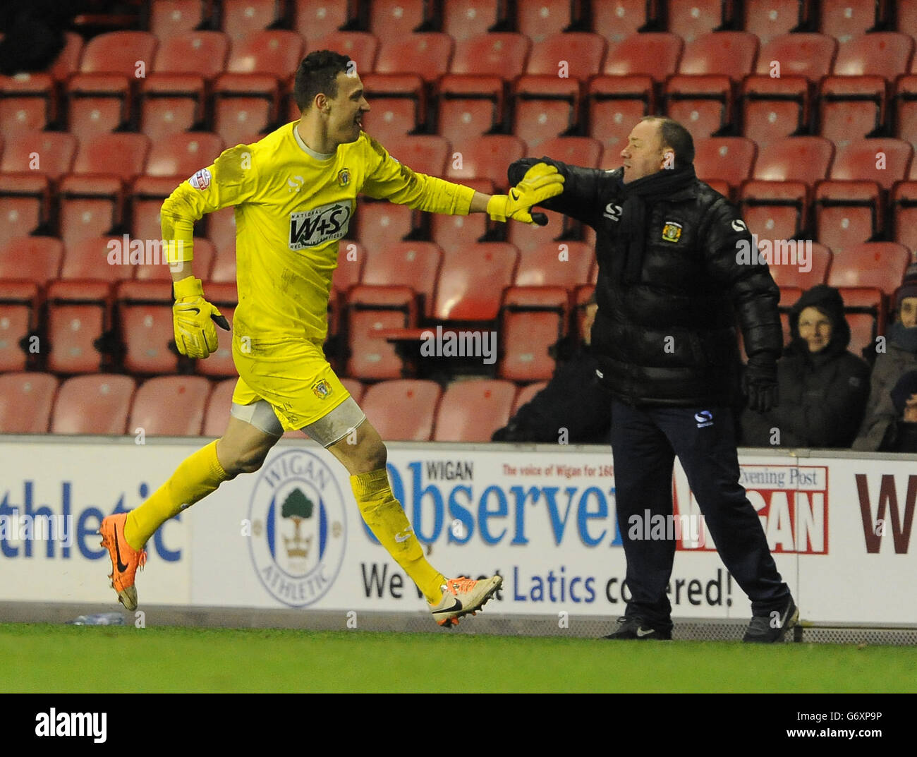 Yeovil Town's goalkeeper Marek Stech (left) celebrates with Manager Gary Johnson after Luke Ayling's injury time equaliser (3-3) against Wigan Athletic. Stock Photo
