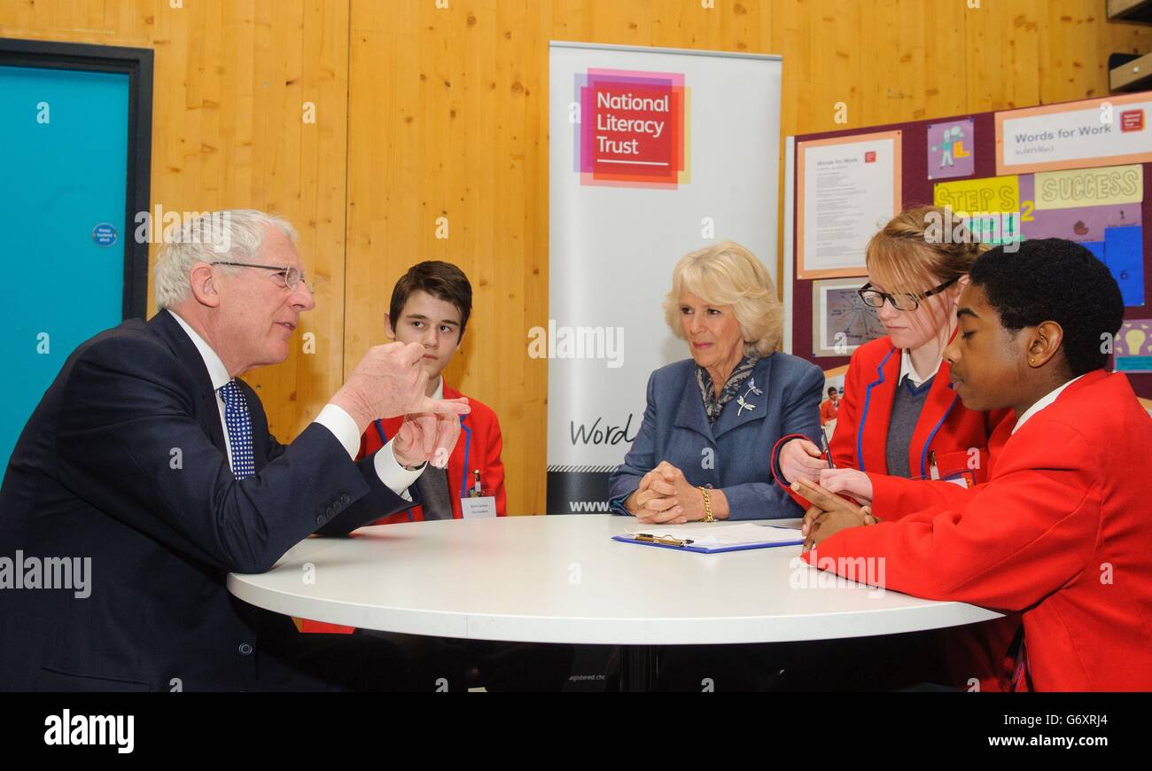 The Duchess of Cornwall (centre) with (left to right) Nick Hewer, and pupils Emre Dunham, Katie Blyth and Joshua Morgan, during a visit to the City Academy, in Hackney, east London, to see the 'Words for Work' programme, which aims to tackle youth unemployment by improving literacy skills. Stock Photo