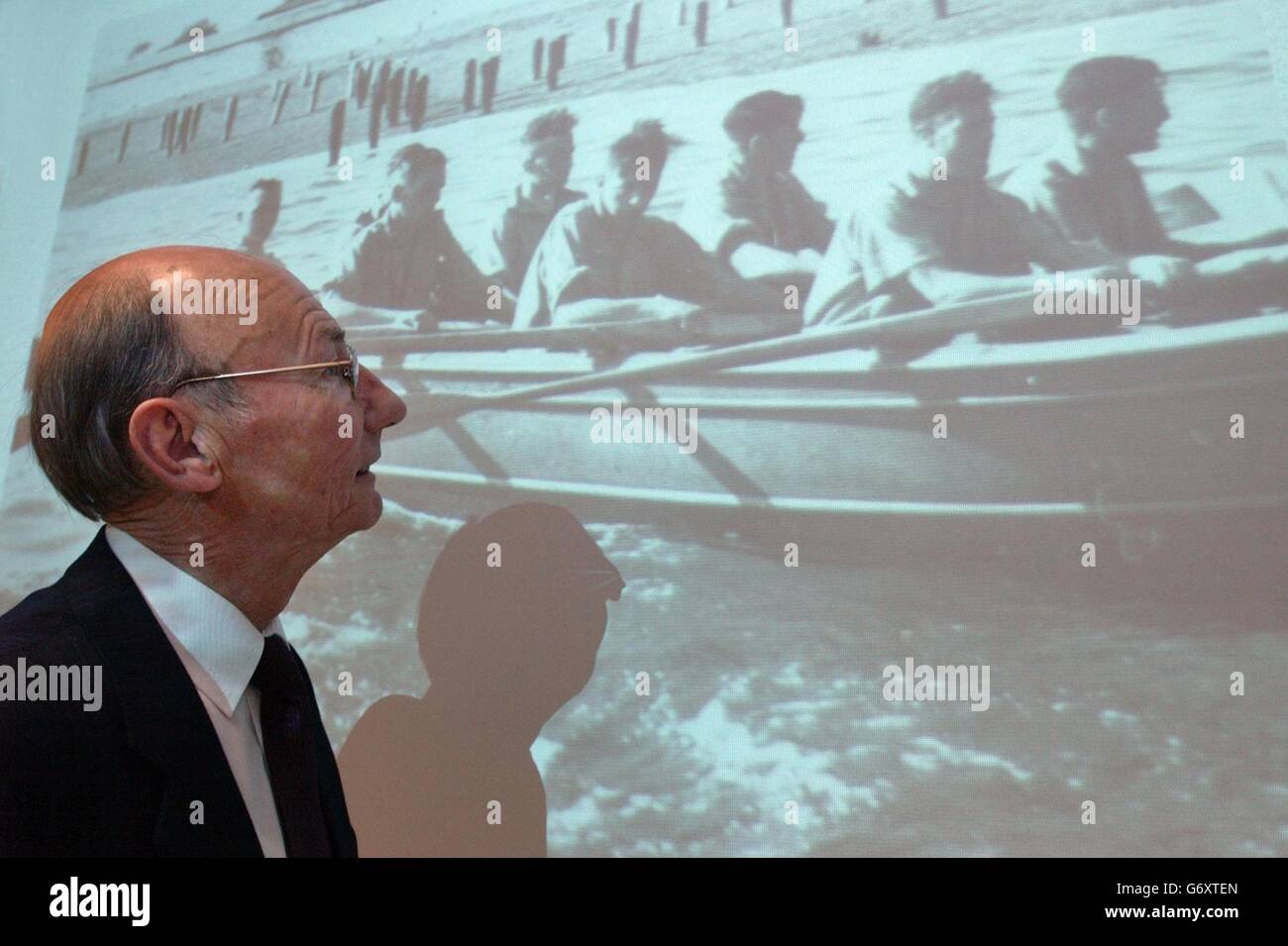 Brian Mills, the brother of late 'Cockleshell hero' Bill Mills, looks at a picture of the commandos training, at Fleet and Nato HQ in Northwood, Middlesex, where he received a medallion on his brother's behalf, commemorating the daring raid he took part in, in 1942. Marine Mills was one of 10 Royal Marine commandos assigned to attack enemy German ships moored at the port of Bordeaux, using five two-man cockleshell canoes launched from the Royal Navy submarine HMS Tuna. Marine Mills and his partner were caught by the French police, handed over to the Germans and executed three months later. Stock Photo