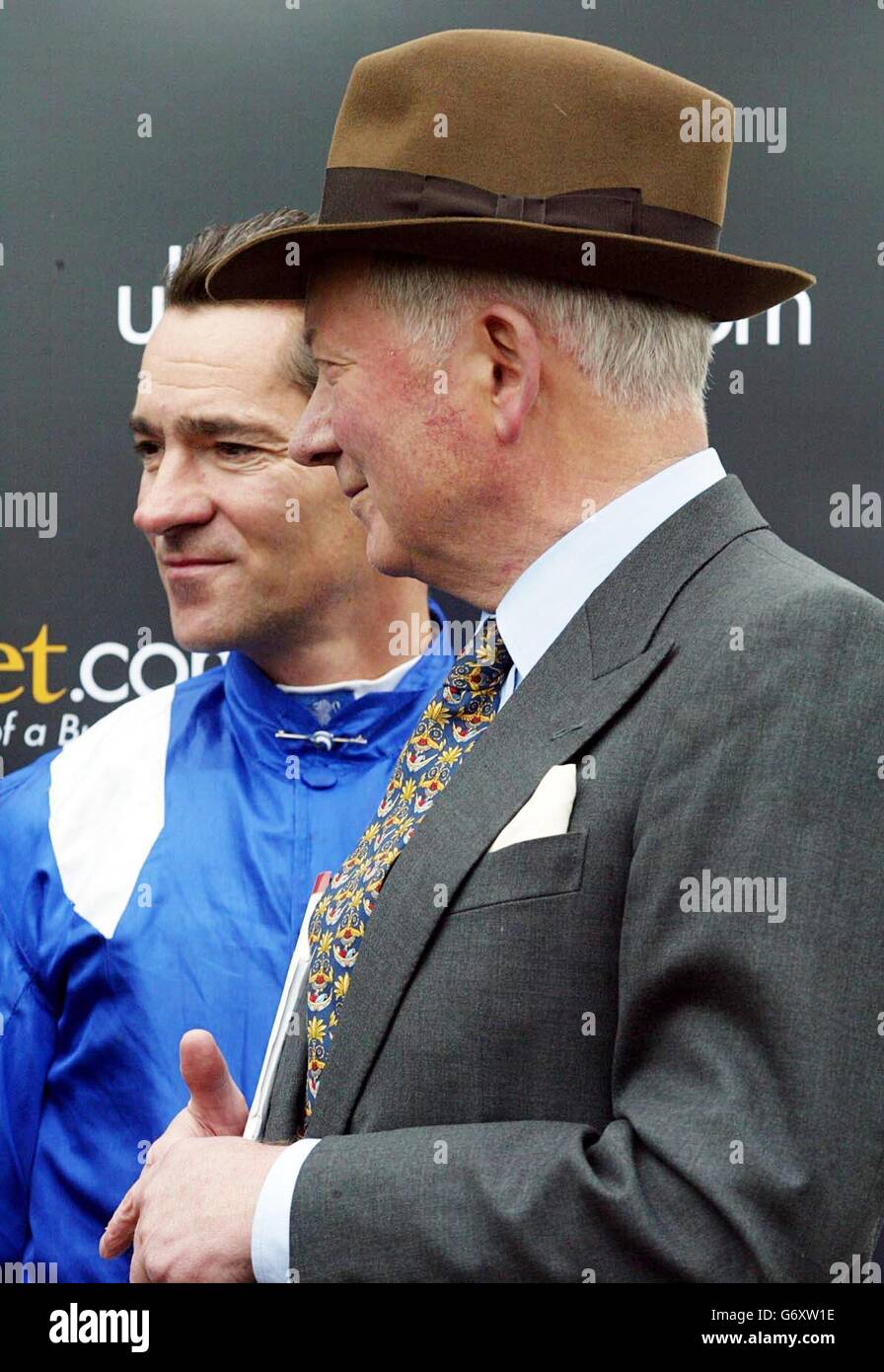 Trainer Barry Hills and his jockey-son Richard (left) celebrate after Haafhd won in the UltimateBet.com 2000 Guineas at Newmarket . Stock Photo