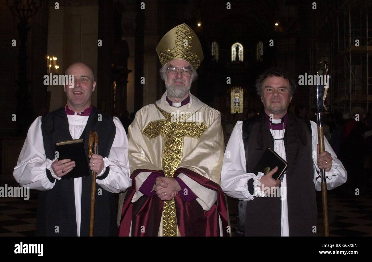 Stephen Cottrell (left) the new Bishop of Reading and Michael Perham (right) the new Bishop of Gloucester, stand with the Archbishop of Canterbury, Dr. Rowan Williams at their consecration at St Paul's Cathedral, London. Stephen Cottrell, 45, was appointed to the post of Bishop of Reading after the gay but celibate cleric Dr Jeffrey John withdrew his acceptance last summer following protests from evangelicals within the Church of England. Stock Photo