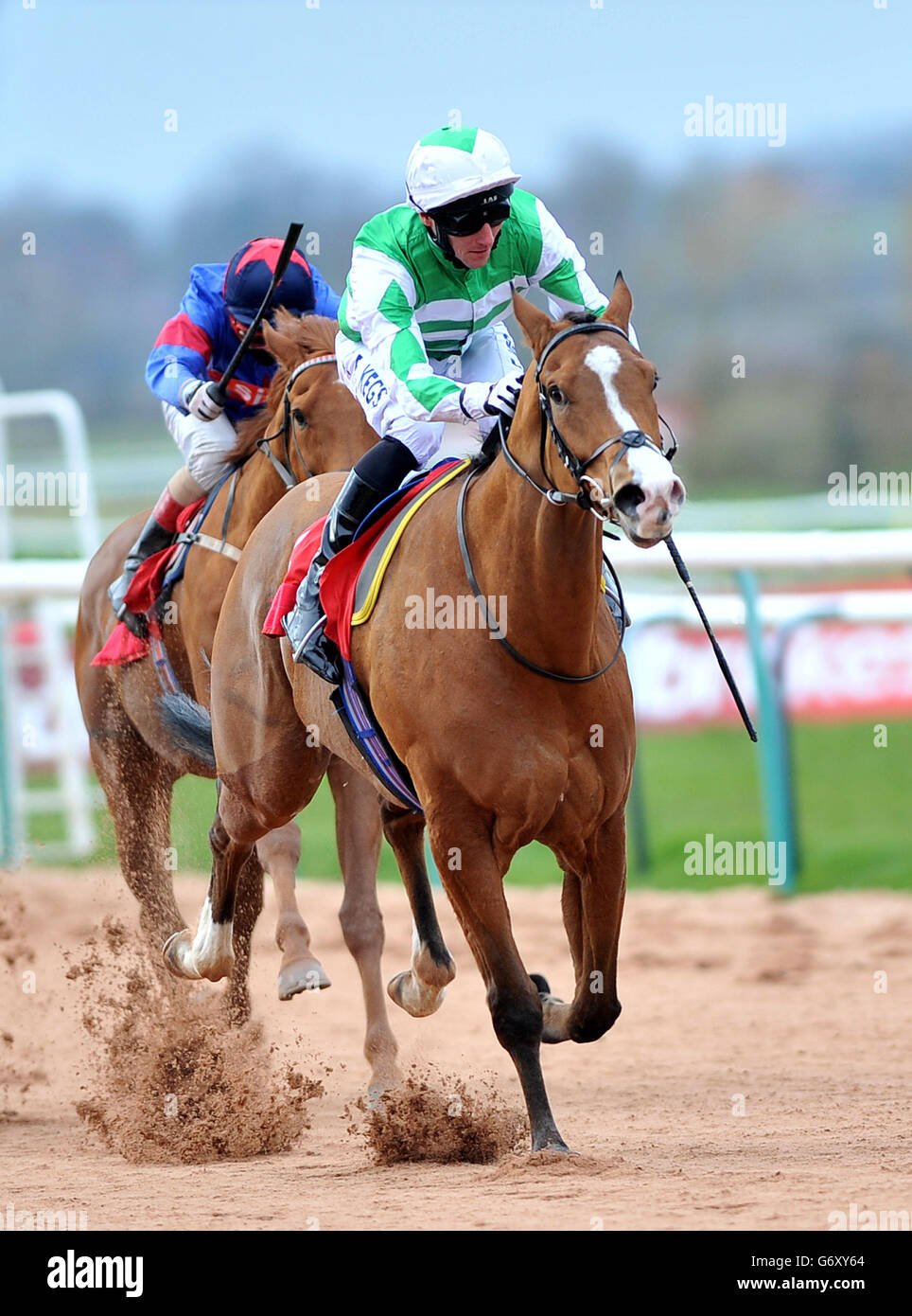 Horse Racing - Southwell Racecourse. Frontier Fighter ridden by Daniel Tudhope (right) wins The Ladbrokes Handicap Stakes at Southwell Racecourse. Stock Photo