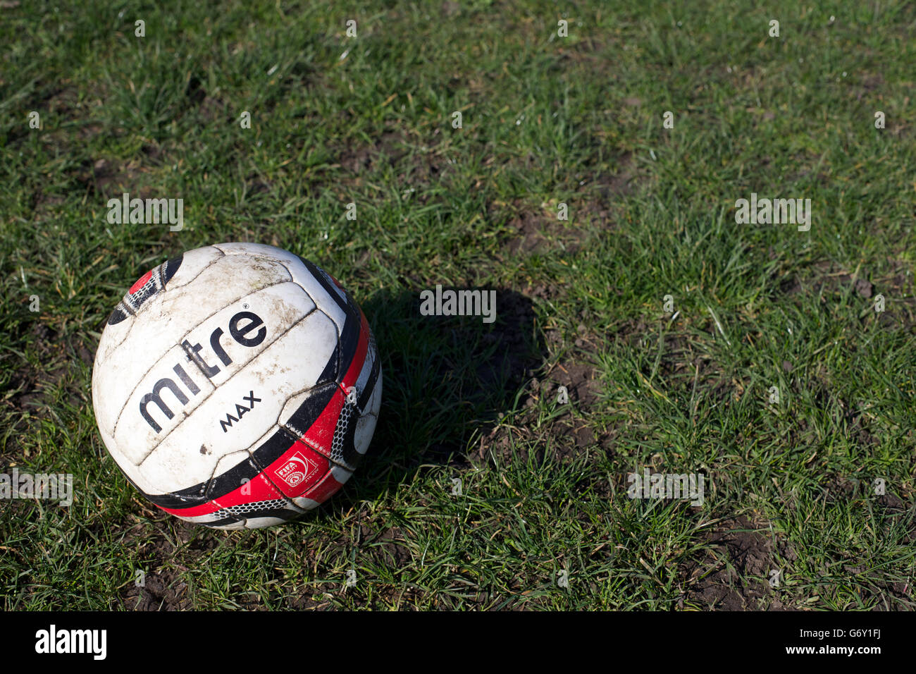 Soccer - Independent South Essex Football League - Sunday Morning Football - AC Milano v Lessa Athletic and Boleyn FC v Cranham. A worn out match day ball on the pitch Stock Photo