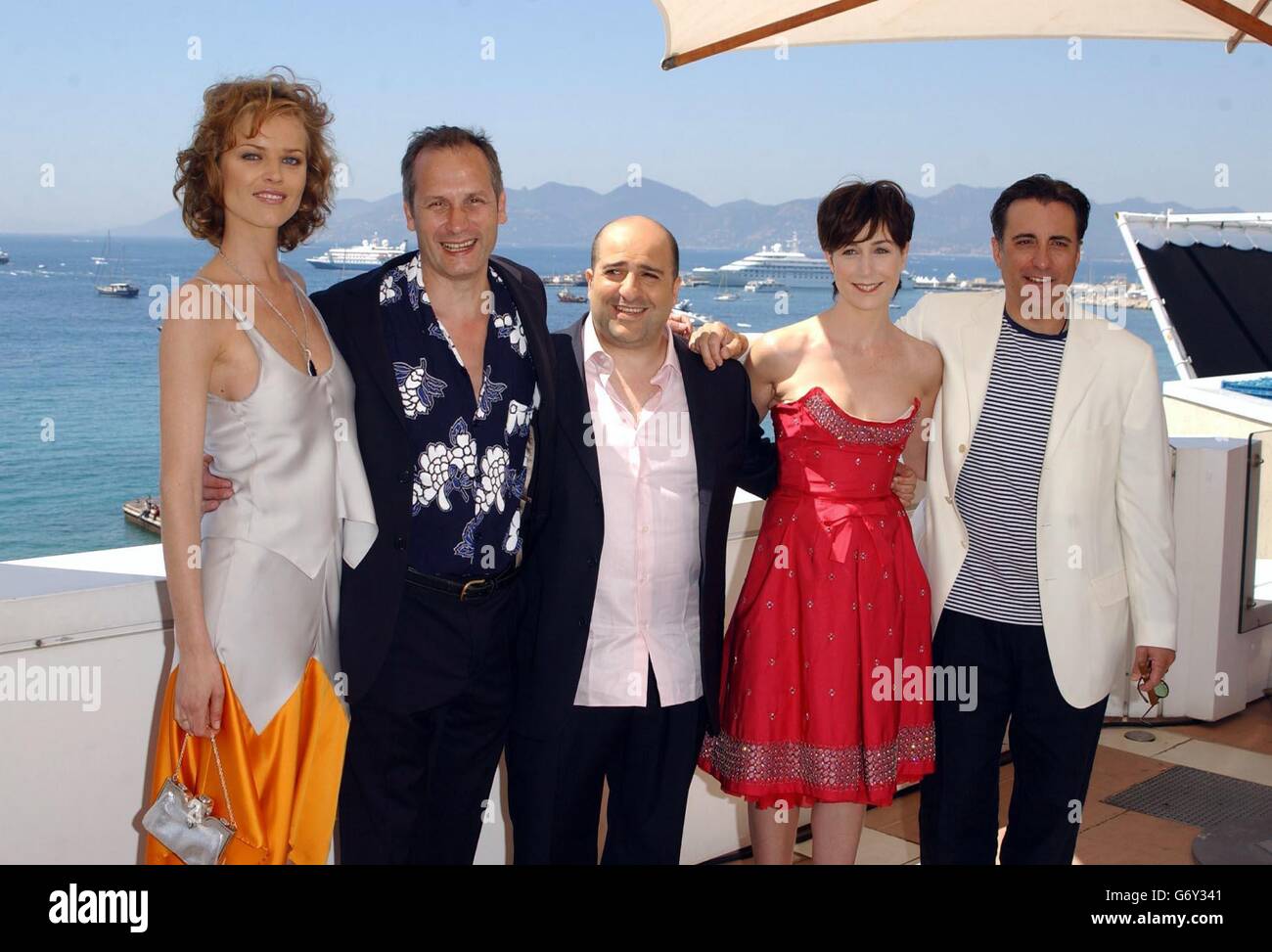 AFP, AP and EPA OUT. (Left-Right) Eva Herzigova, film director Mick Davis, Omid Djalili, Elsa Zylberstein and Andy Garcia during a photocall for their latest film Modigliani, held on the roof of the Noga Hilton Hotel during the 57th Cannes Film Festival in France. Stock Photo