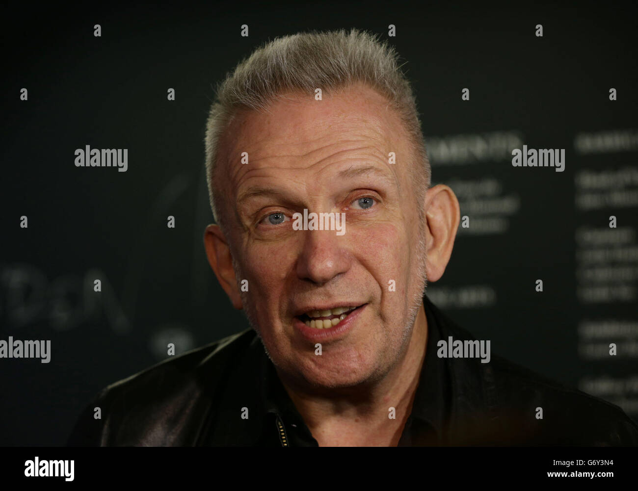 Jean Paul Gaultier during a media view of 'The Fashion World of Jean Paul Gaultier: From the Sidewalk to the Catwalk' - the first major exhibition devoted to the celebrated French couturier, including costumes for film and performance including the conical bra and corsets Madonna wore during her 1990 Blond Ambition World Tour, stage costumes designed for Kylie Minogue as well as pieces created for the films of Pedro Almodovar among others - at Barbican Art Gallery in London. Stock Photo