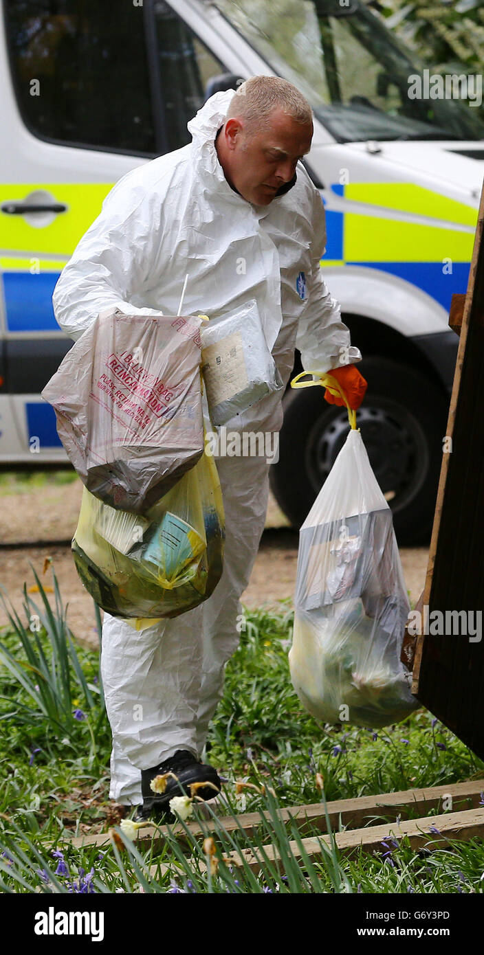 Police investigators search the contents of the bins at the home of Peaches Geldof in Wrotham, Kent, after the 25-year-old was found dead at home yesterday afternoon. Stock Photo