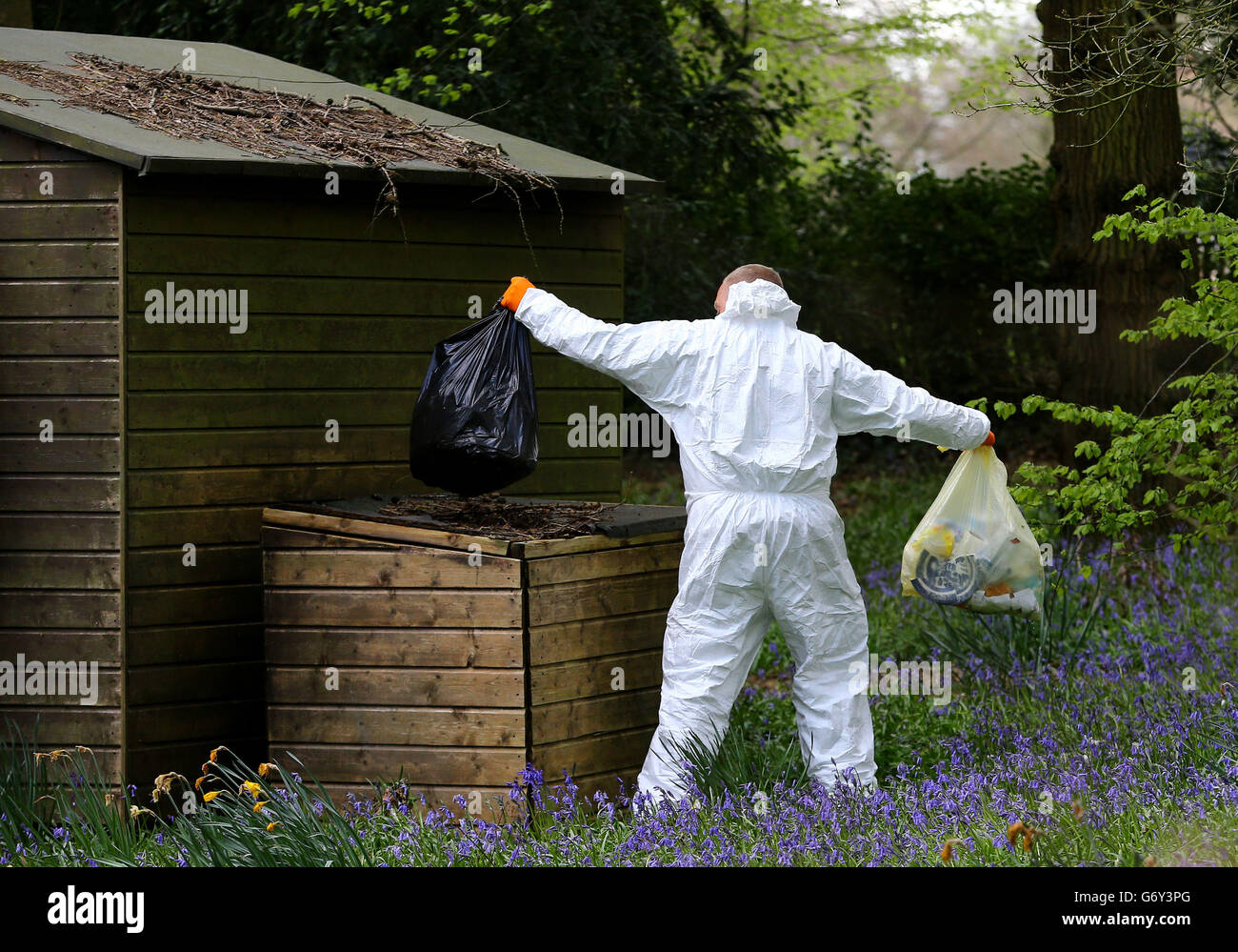 Police investigators search the contents of the bins at the home of Peaches Geldof in Wrotham, Kent, after the 25-year-old was found dead at home yesterday afternoon. Stock Photo