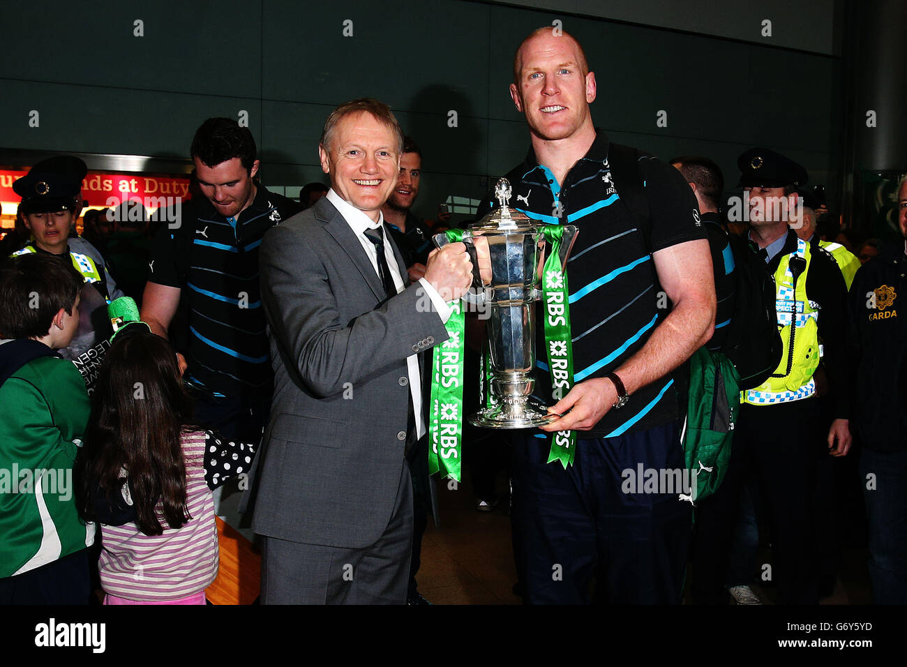 Ireland captain Paul O'Connell (right) and head coach Joe Schmidt with the 6 nations trophy as the Ireland team arrive at Dublin Airport, Ireland. Stock Photo