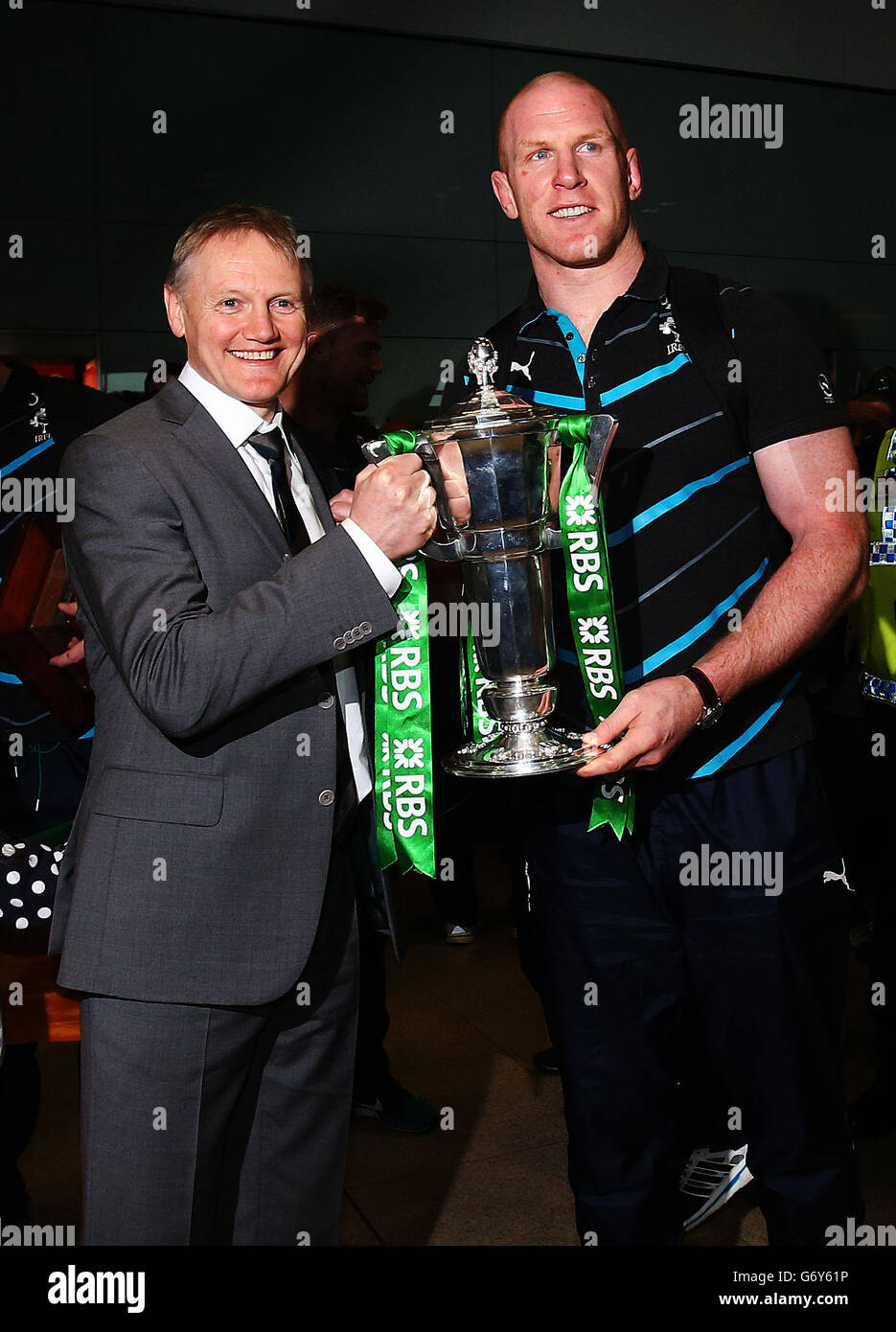 Ireland captain Paul O'Connell (right) and head coach Joe Schmidt with the 6 nations trophy as the Ireland team arrive at Dublin Airport, Ireland. Stock Photo