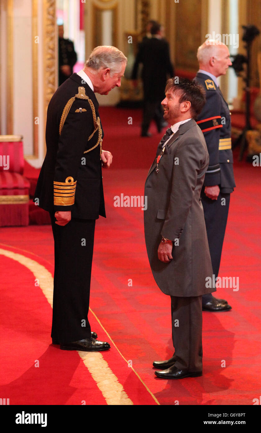 Basil Newby from Poulton-Le-Fylde is made a Member of the Order of the British Empire (MBE) by the Prince of Wales during an Investiture ceremony at Buckingham Palace, central London. Stock Photo