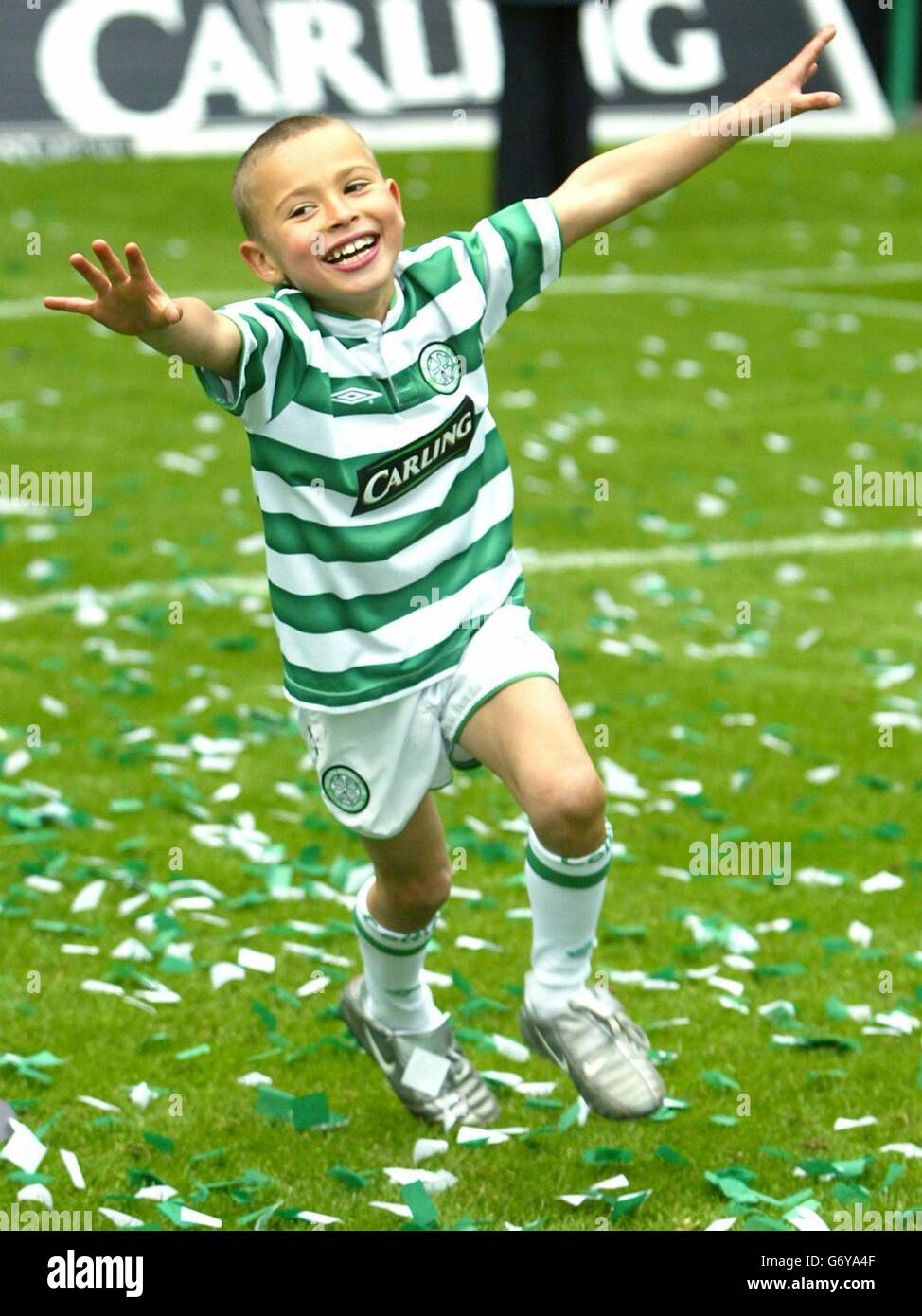 Jordan, the son of Celtic's Swedish striker Henrik Larsson, celebrates after the team were presented with the Bank of Scotland Premier League trophy at Celtic park, Glasgow. *EDITORIAL USE ONLY* Stock Photo