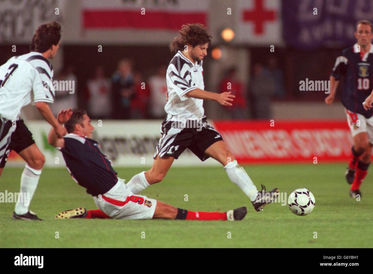 Soccer - World Cup Qualifier - Austria v Scotland. Wolfgang Feiersinger of Austria (right) dodges a tackle from Ally McCoist of Scotland (left) Stock Photo