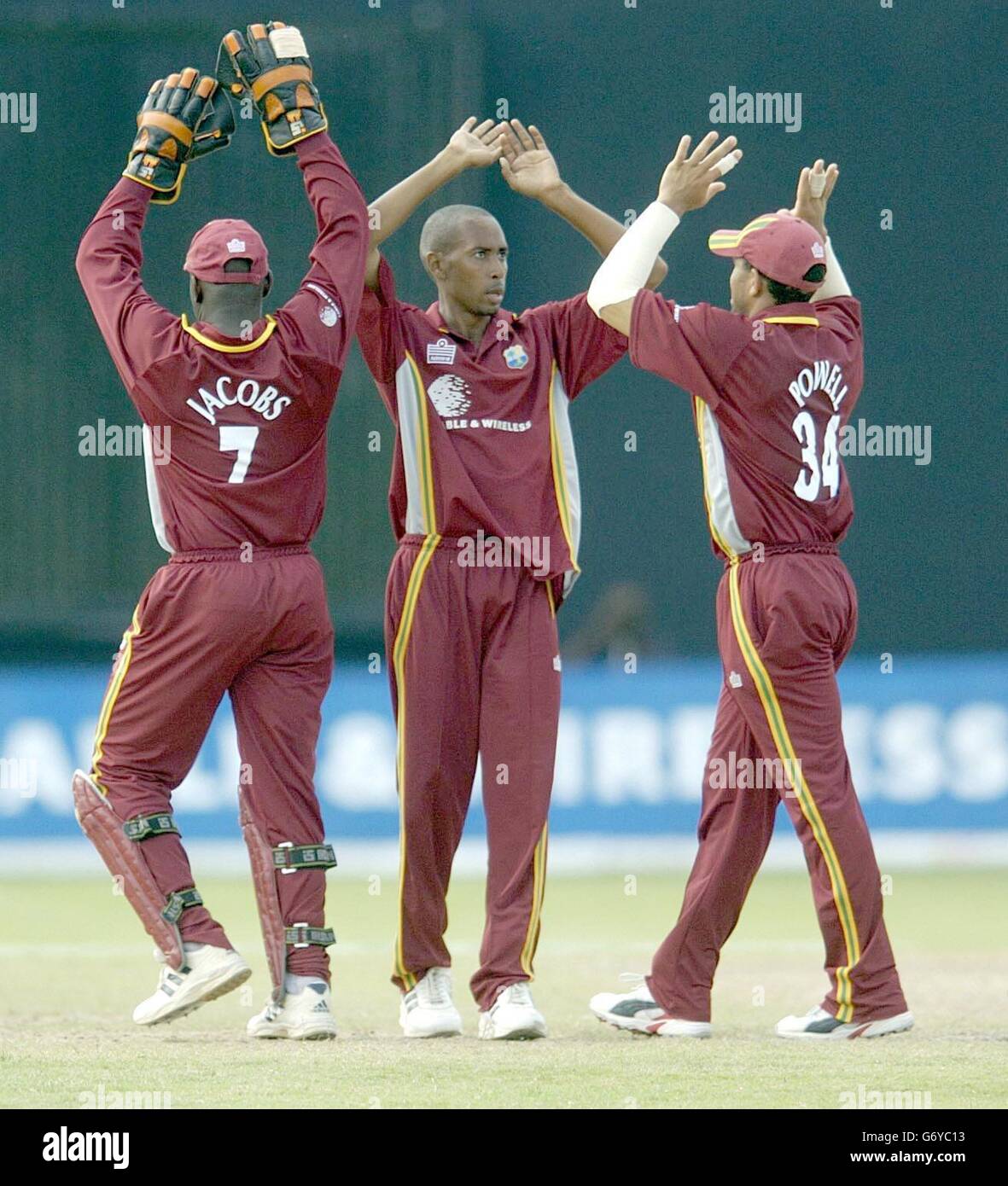West Indian wicketkeeper Ridley Jacobs, (left) Ian Bradshaw and Ricardo Powell celebrate the dismissal of England batsman Rikki Clarke for 9 runs, during the 7th One Day International at the Kensington Oval, Bridgetown, Barbados. Stock Photo