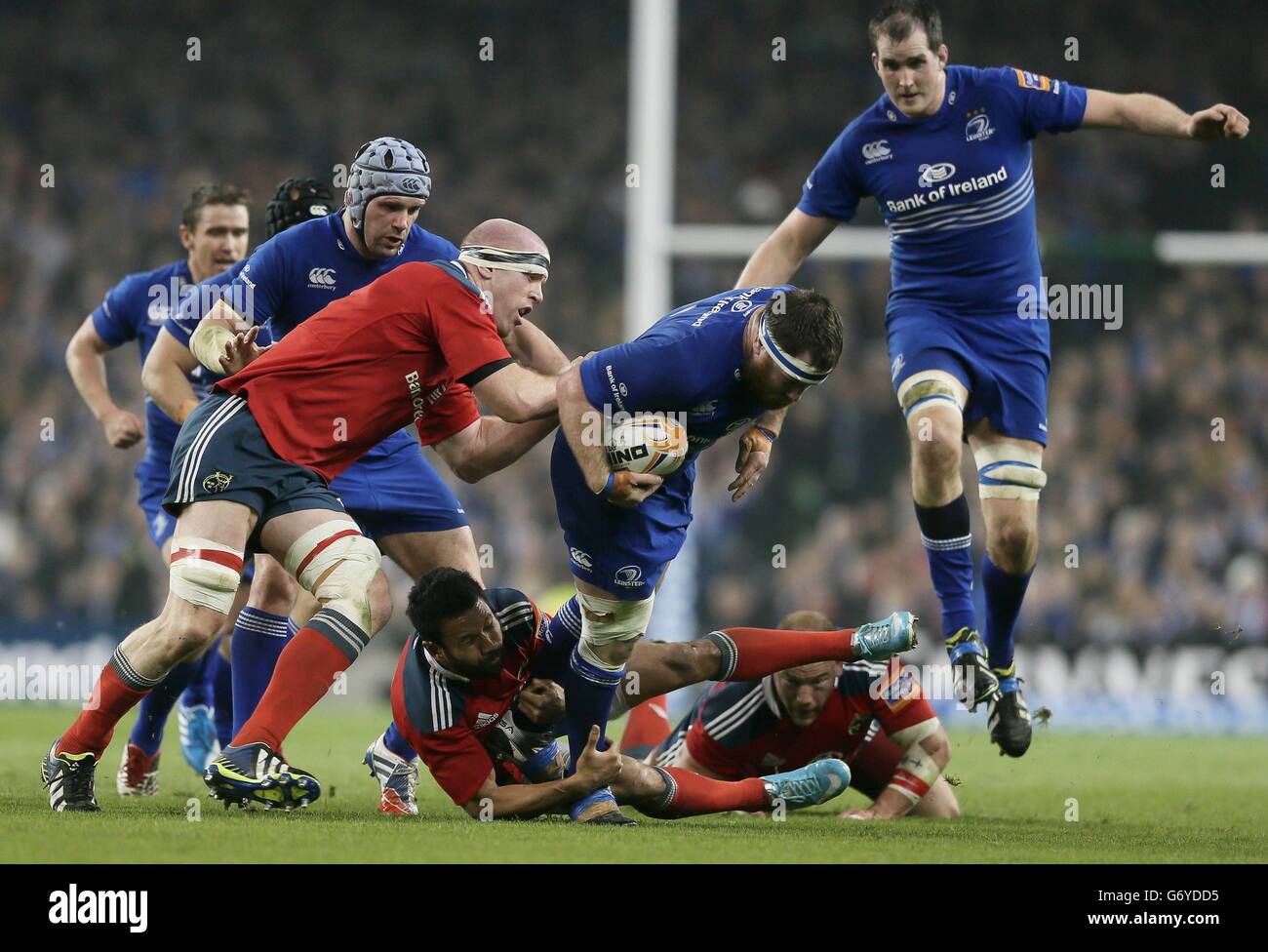 Leinster's Michael Bent is tackled by Munster's Casey Laulala and Paul  O'Connell during the RaboDirect PRO12 match at the Aviva Stadium, Dublin,  Ireland Stock Photo - Alamy