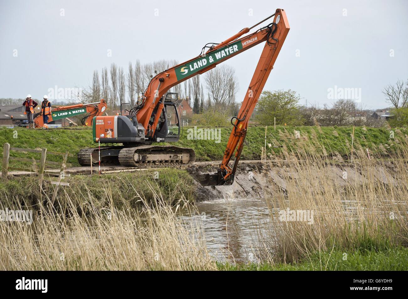 Spring weather March 31st. Dredging begins on the River Parrett, near Burrowbridge in Somerset, where the area suffered flooding. Stock Photo