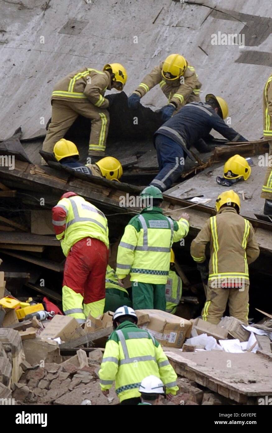 Emergency services remove roofing off a plastics factory in the west