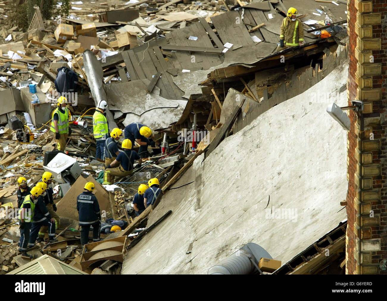 Fire fighters look through the rubble for survivors at the Stockline