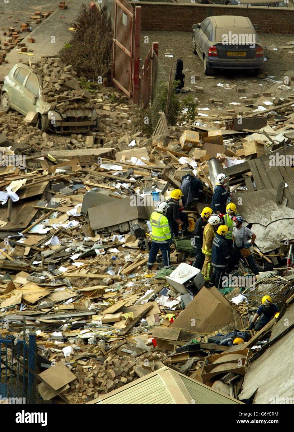 Fire fighters look through the rubble for survivors at the Stockline