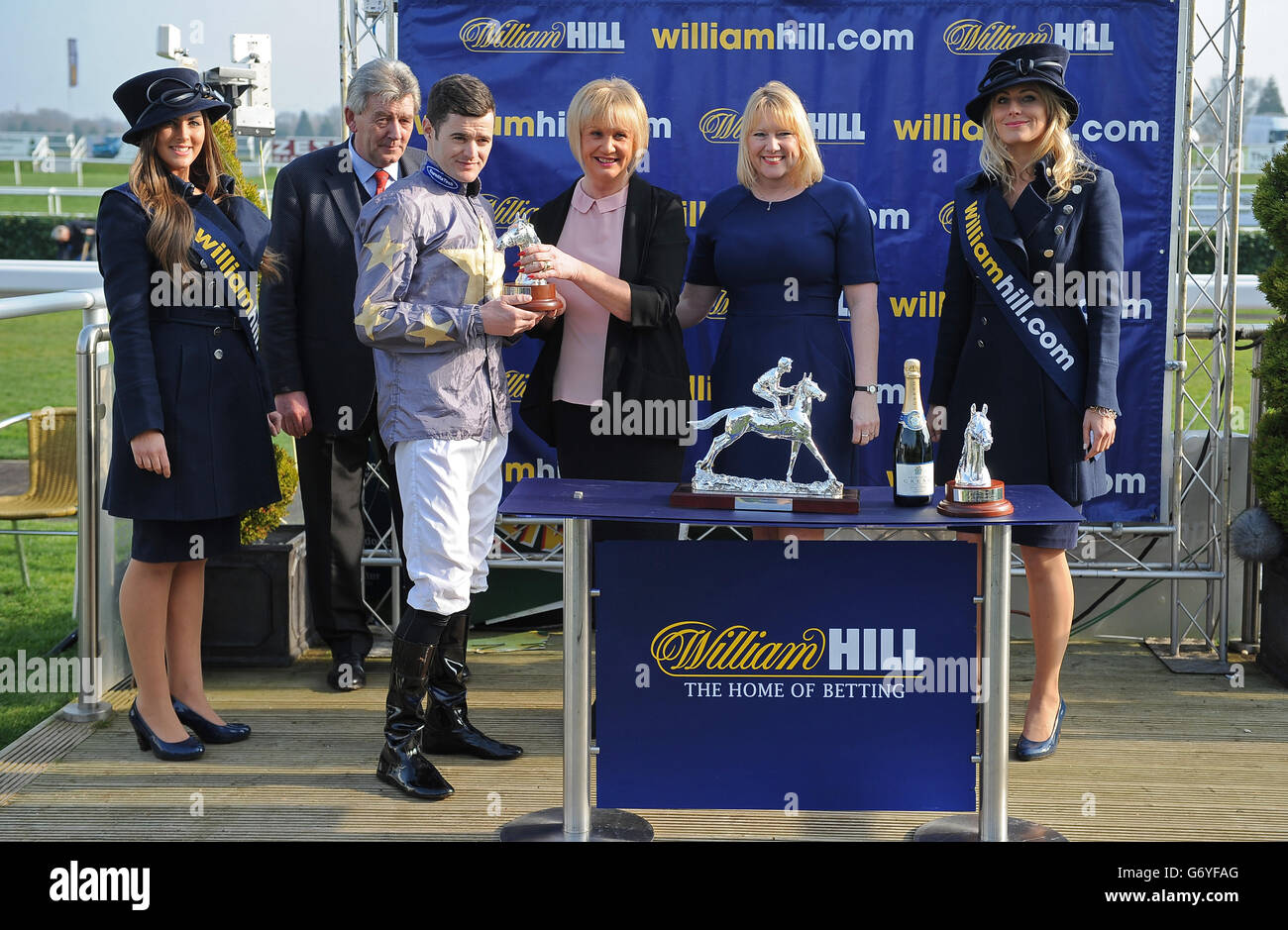 Horse Racing - 2014 William Hill Lincoln - Day One - Doncaster Racecourse. Jockey David Nolan collects his trophy after Brae Hill wins The William Hill Spring Mile Stock Photo