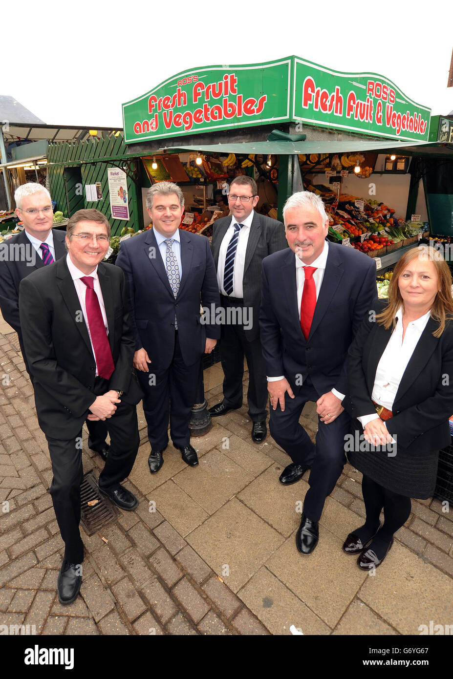 (Left to right) Peter Donohoe, Head of Region at Marks and Spencer, Martyn Hulme, Managing Director of Cooperative Estates at The Co-operative Group and Chair of Business In The Community's Healthy High Streets Steering Group, Brandon Lewis MP, High Streets Minister, Karl Crane, Stores Director at Boots UK, Kingsley Taylor, Divisional Manager of Business Banking at Santander, and Jane Pritchard, Enterprise Director at Business In The Community, tour the 6 day market in Great Yarmouth, Norfolk, England, to launch BITC's new Healthy High Streets campaign, working with businesses to support UK Stock Photo