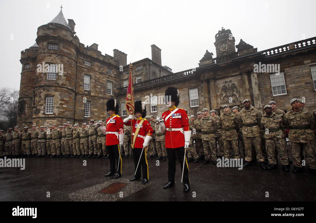 Royal Scots Dragoon Guards march outside the Palace of Holyroodhouse in Edinburgh, during a homecoming parade which marks the regiment's return from Afghanistan. Stock Photo