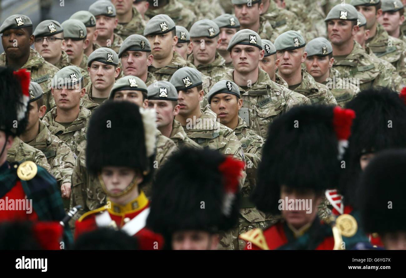 Royal Scots Dragoon Guards march towards the Palace of Holyroodhouse in Edinburgh, during a homecoming parade which marks the regiment's return from Afghanistan. Stock Photo