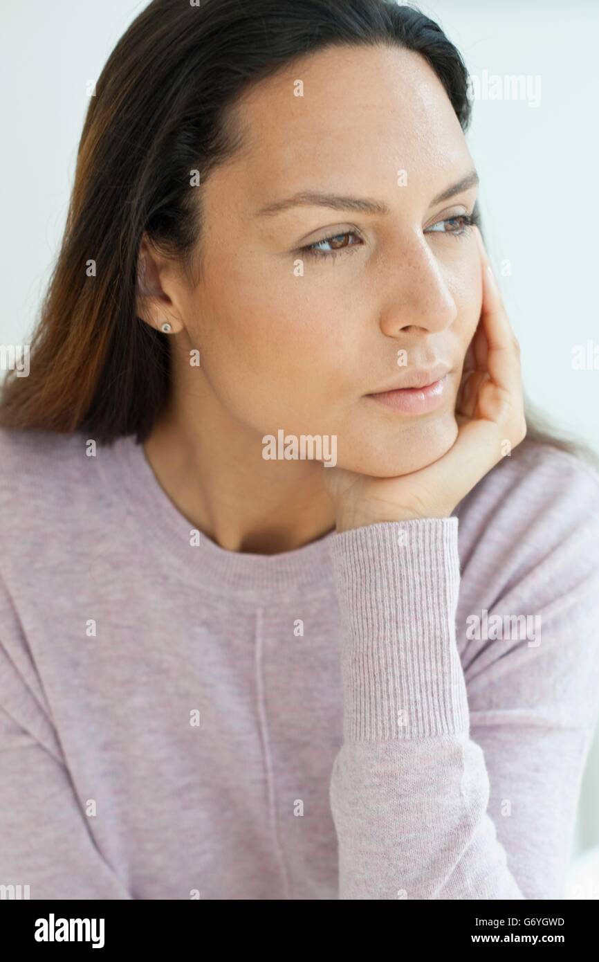 Woman hand on chin hi-res stock photography and images - Alamy