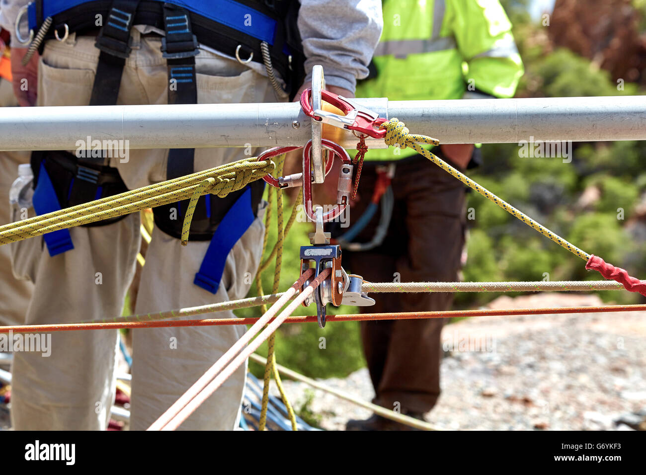 Close up of ropes and pulleys for rescue workers to climb down the side of the cliff. Stock Photo