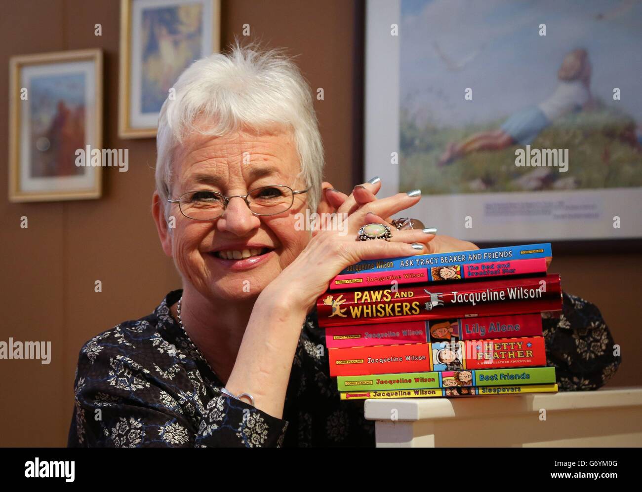 Dame Jacqueline Wilson poses for photographers in a recreation of her